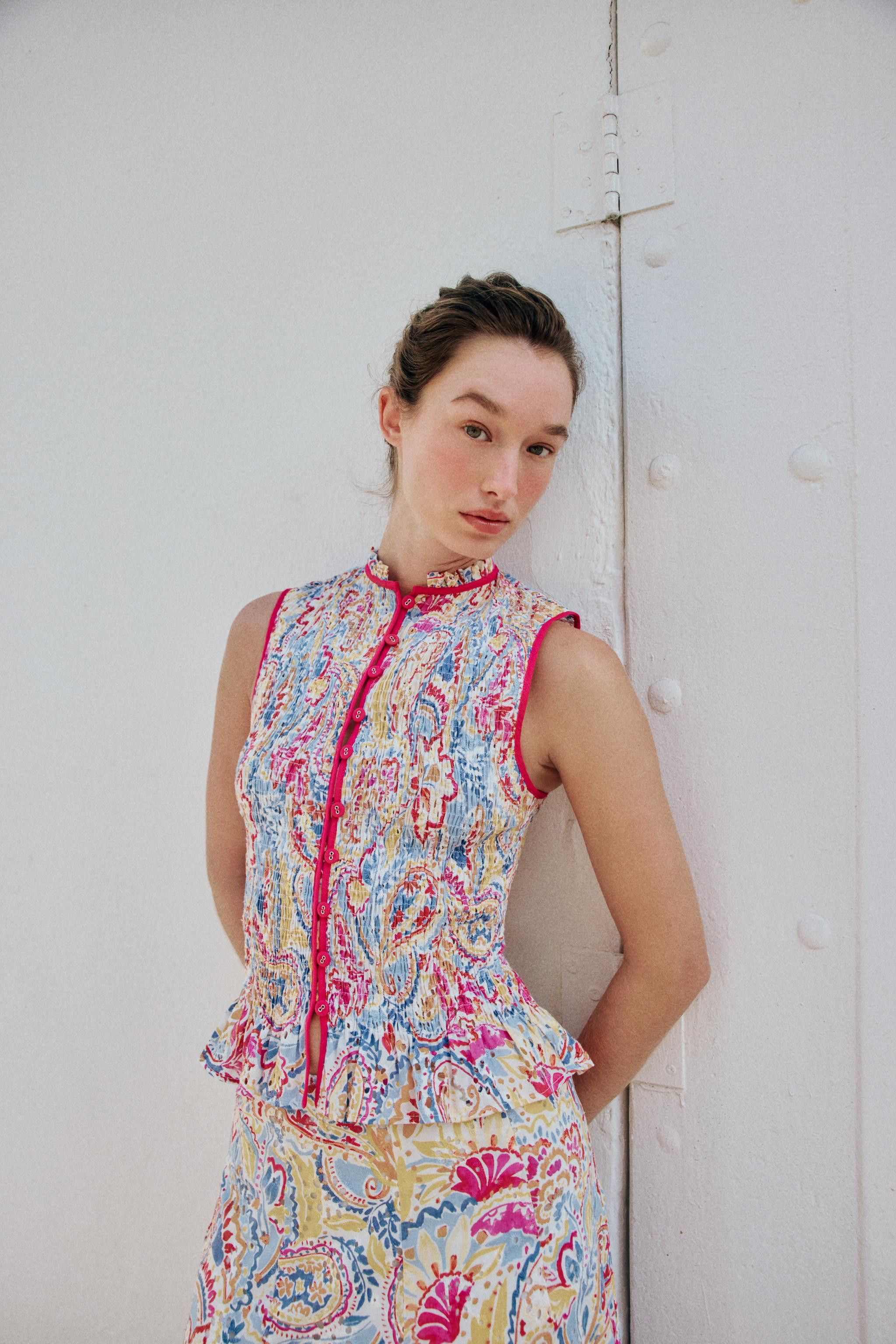 Ruffled collar sleeveless top. Features smocked elastic detailing and openwork embroidery. Front ... | Zara US