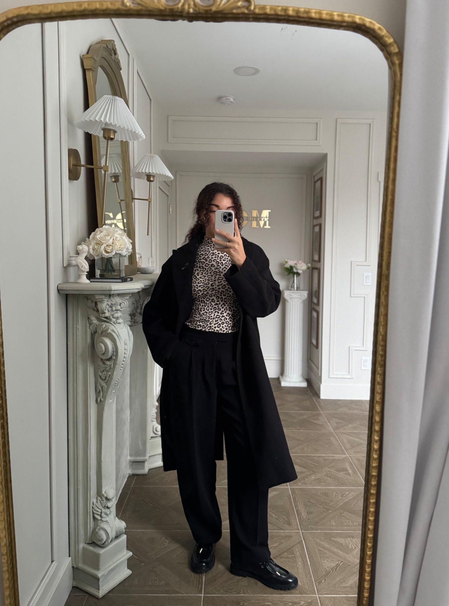 Black pants winter outfit: black pants, leopard print turtleneck, Oxford shoes, long black wool coat 

#LTKootd #LTKSeasonal