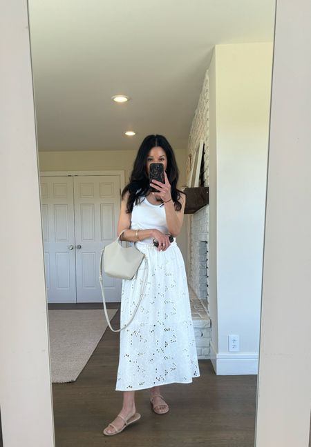 My white eyelet skirt is back in stock and on sale! I’m wearing a small. It is lined and not at all see through. 

White tank with a built-in shelf bra. It runs big. I’m wearing a small here, but I might even size down to an XS. 

Bag is Zara

Beige sandals are Target and super comfortable. This color goes with everything. 

White midi skirt
White embroidered skirt 
Best white tank top

#LTKSaleAlert #LTKShoeCrush #LTKOver40