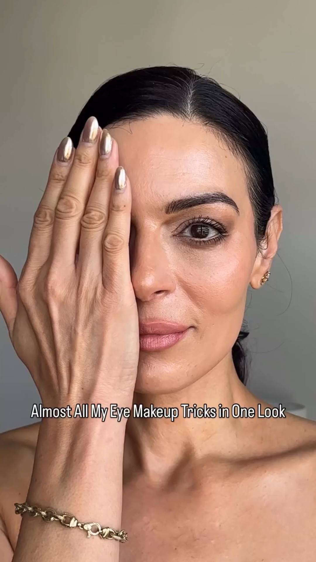 My eye makeup secrets for bigger, lifted eyes.

I start with a @armanibeauty liquid eyeshadow, applying just above my natural fold with my eyes open to create lift, then blend it across the mobile lid for depth. Next, I layer a @makeupbymario deeper brown shade in a sideways “V” at the outer corner and extend it along the outer third of the lower lash line for definition.

To open the eyes even more, I run a @maybelline nude pencil through my waterline and extend it straight from the outer corner—this not only elongates the eye but also creates a guide for the liner that comes next. Using a @benefitcosmetics fine brow pencil, I am deepening the outer corner of my lower lash line and extending the lower ring past my eye. With a @maybelline fine liquid liner, I draw a straight line from my top lid outward, keeping it subtle and never past the crease (that’s key for hooded eyes). I’ve created parallel lines that contrast beautifully with the nude pencil for a double-liner effect.

From there, I curl my lashes, apply @lancomeofficial primer, and layer @yslbeauty mascara for lift. I make sure to use a lash comb between every layer. To finish, I take a @makeupforever dark brown or black liner and carefully dot it between the lashes along the lash line. This adds depth and makes lashes look fuller.

The result? Bright, lifted, defined eyes—soft glam that works every time.

#LTKBeauty