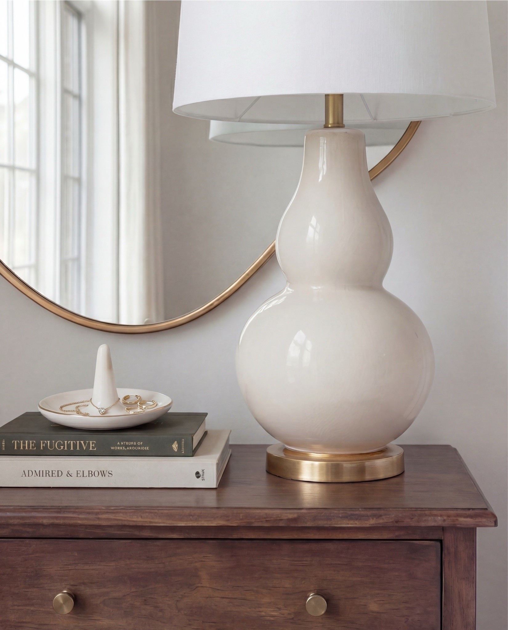 Shop the Look:
• White upholstered arched headboard bed
• White cotton duvet cover + pillow shams
• Green vintage-style area rug (distressed pattern)
• Brown chunky knit throw blanket
• Dark wood nightstands with cane doors
• White ceramic table lamp (round base)
• Brass wall sconces with glass shades
• Organic shape gold wall mirrors
• Black and beige abstract framed wall art
• Green geometric throw pillows
• Upholstered brown bench (channel tufted)
• Dark wood dresser with brass pulls
• Round ivory accent chair
• Cream throw blanket (soft knit texture)
• Tall brass floor lamp with white shade
• Decorative book stack (neutral tones)
• Small wood decorative box
• Brass round tray
• White pedestal decorative bowl
• Marble candle holders with brass rings
• Taper candles (ivory)
• Large ceramic vase with dried stems

#LTKHome #LTKSaleAlert