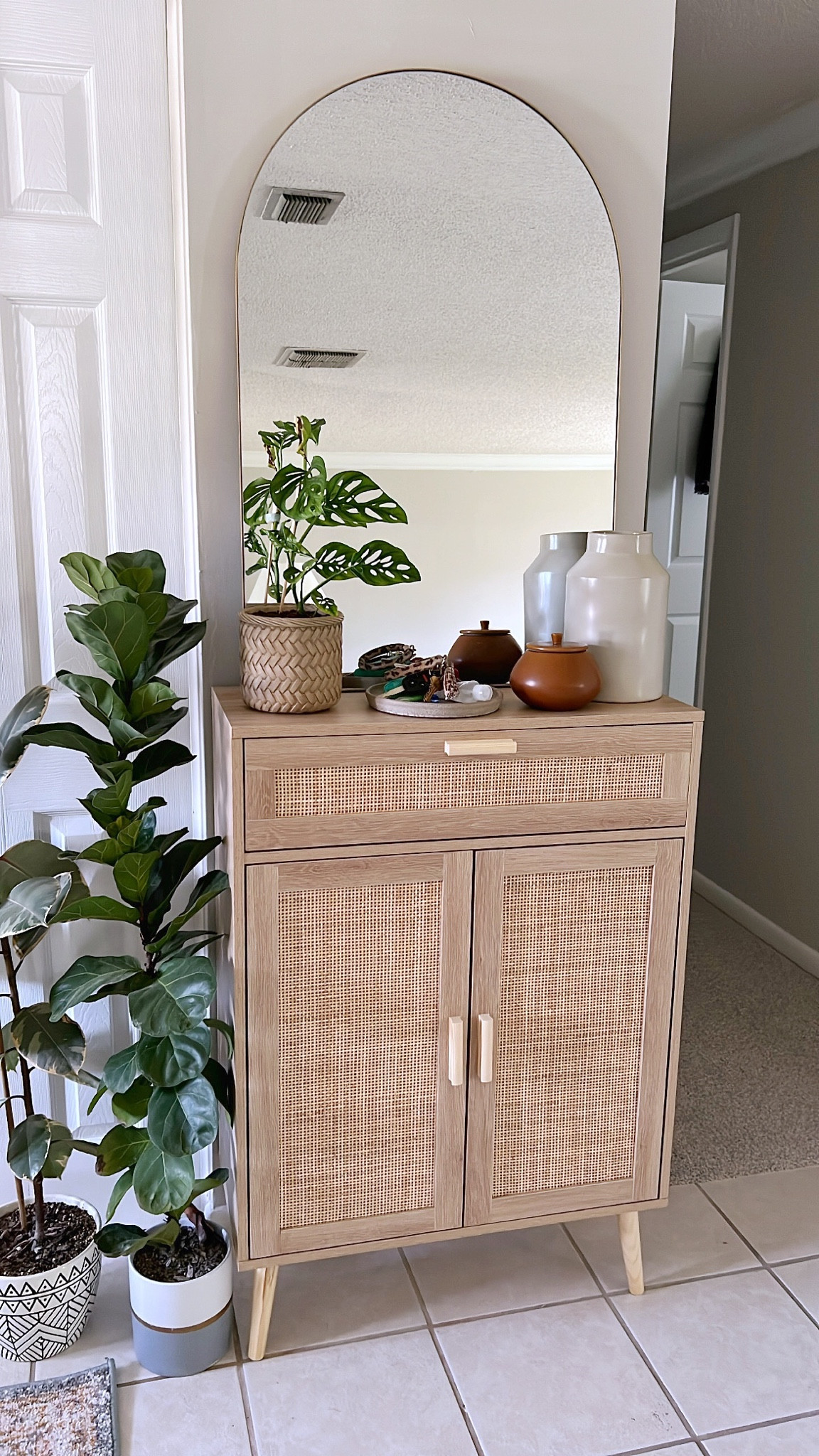 Rattan Entryway Table and Arched Mirror

Small console table, storage cabinet with rattan doors, extra storage space, organization, planter, saucer, Amazon Prime Day deals, Amazon find, Amazon home decor, home decor

#LTKSeasonal #LTKFind #LTKhome
