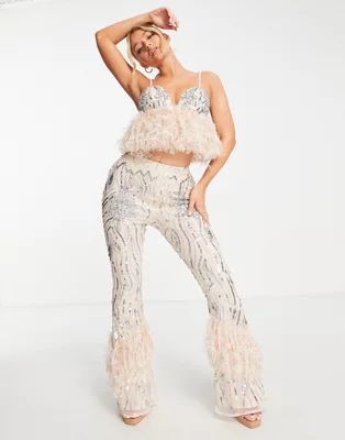 ASOS LUXE embellished gemstone kick flare pants with faux feather hem in blush | ASOS (Global)