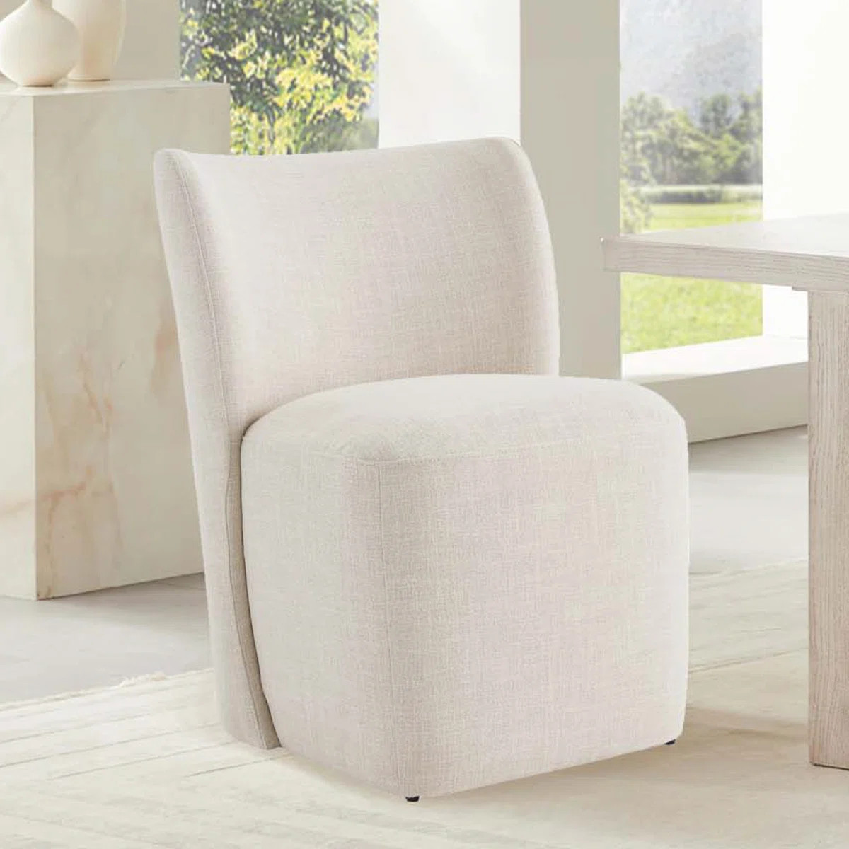 Madie Upholstered Dining Chair with Casters | Wayfair North America