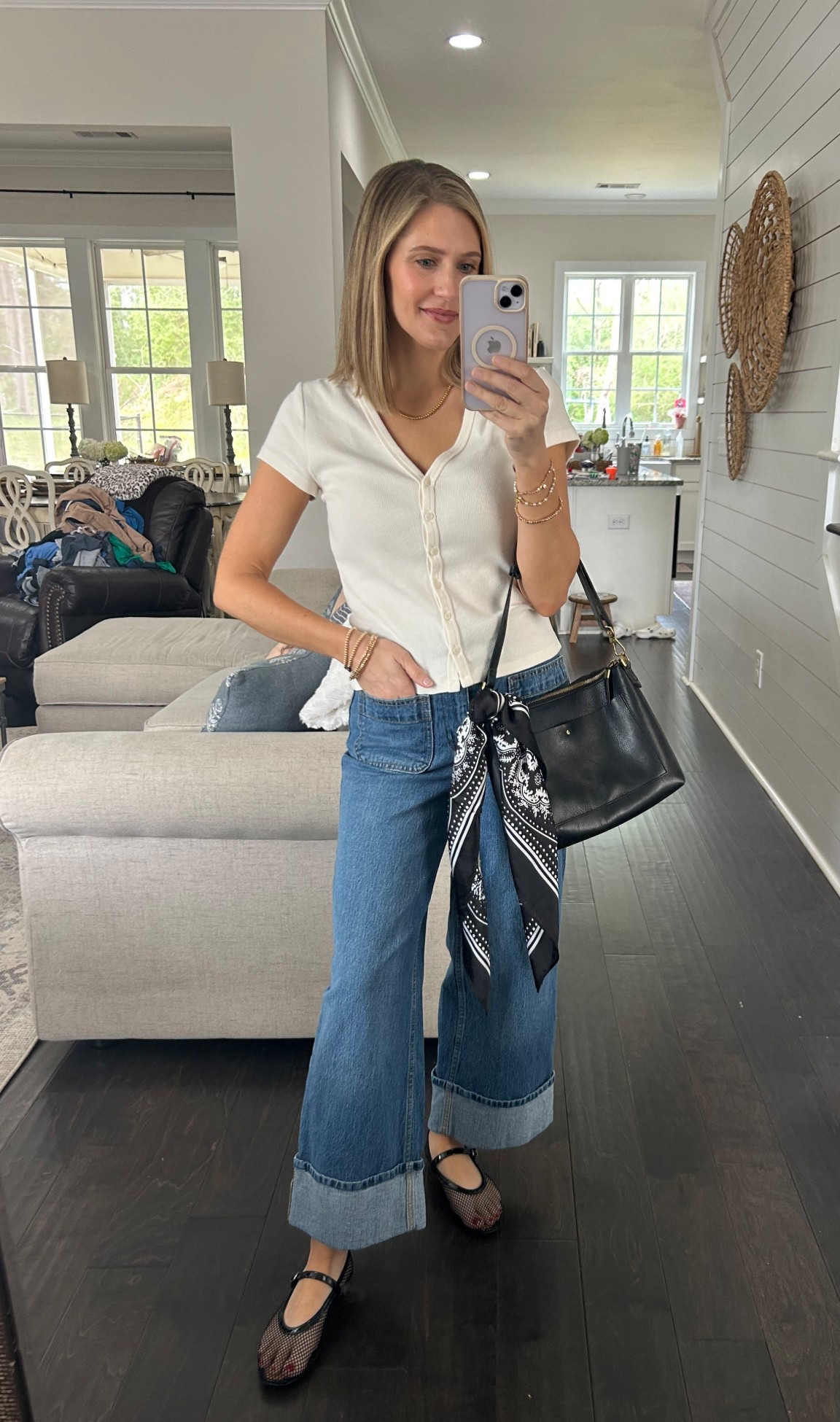 A white top and jeans spruced up with a cute scarf on the purse!

#scarf #denim #momoutfits #easyoutfits 