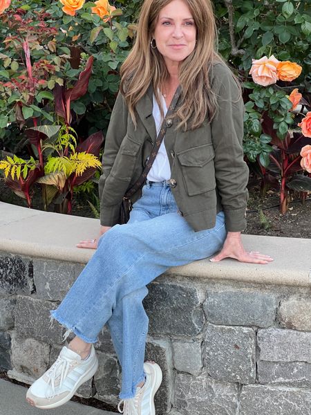 Here's an easy breezy travel outfit to recreate! Relaxed wide leg jeans, white top, cropped utility jacket and sneakers.
#outfitidea #springfashion #capsulewardrobe #casualwear

#LTKTravel #LTKStyleTip #LTKSeasonal