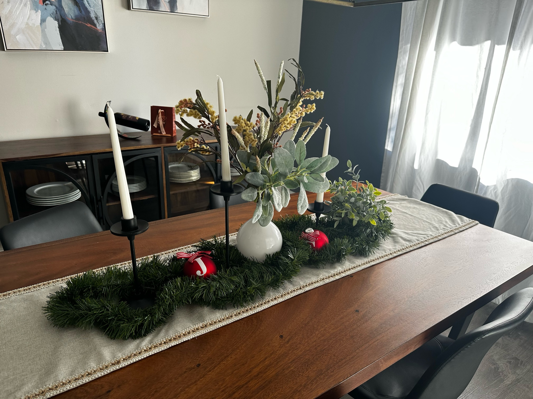 Simple Christmas table scape with greenery and leftover ornaments 

#LTKhome #LTKSeasonal #LTKHoliday