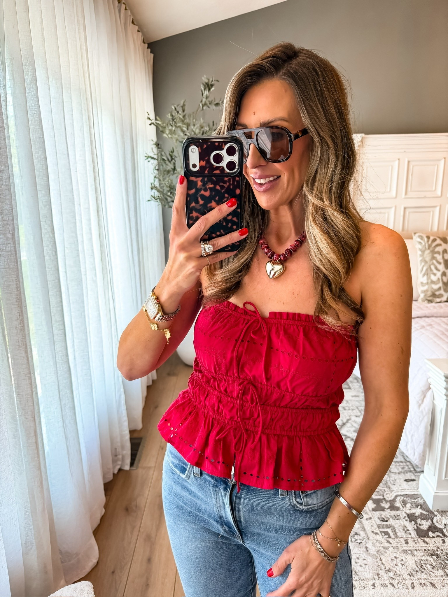 This top is such a good summer statement piece ❤️ I love the bright pop of color with the feminine details, and paired with classic denim it feels equal parts fun and effortless. One of those outfits that instantly looks like you put in way more effort than you actually did.

summer outfit ideas, red top outfit, denim style, casual chic outfit, date night outfit, vacation style, elevated everyday look, feminine fashion, easy summer style, casual outfit inspiration, TheMomInStyle

#LTKootd #LTKSeasonal #LTKTravel