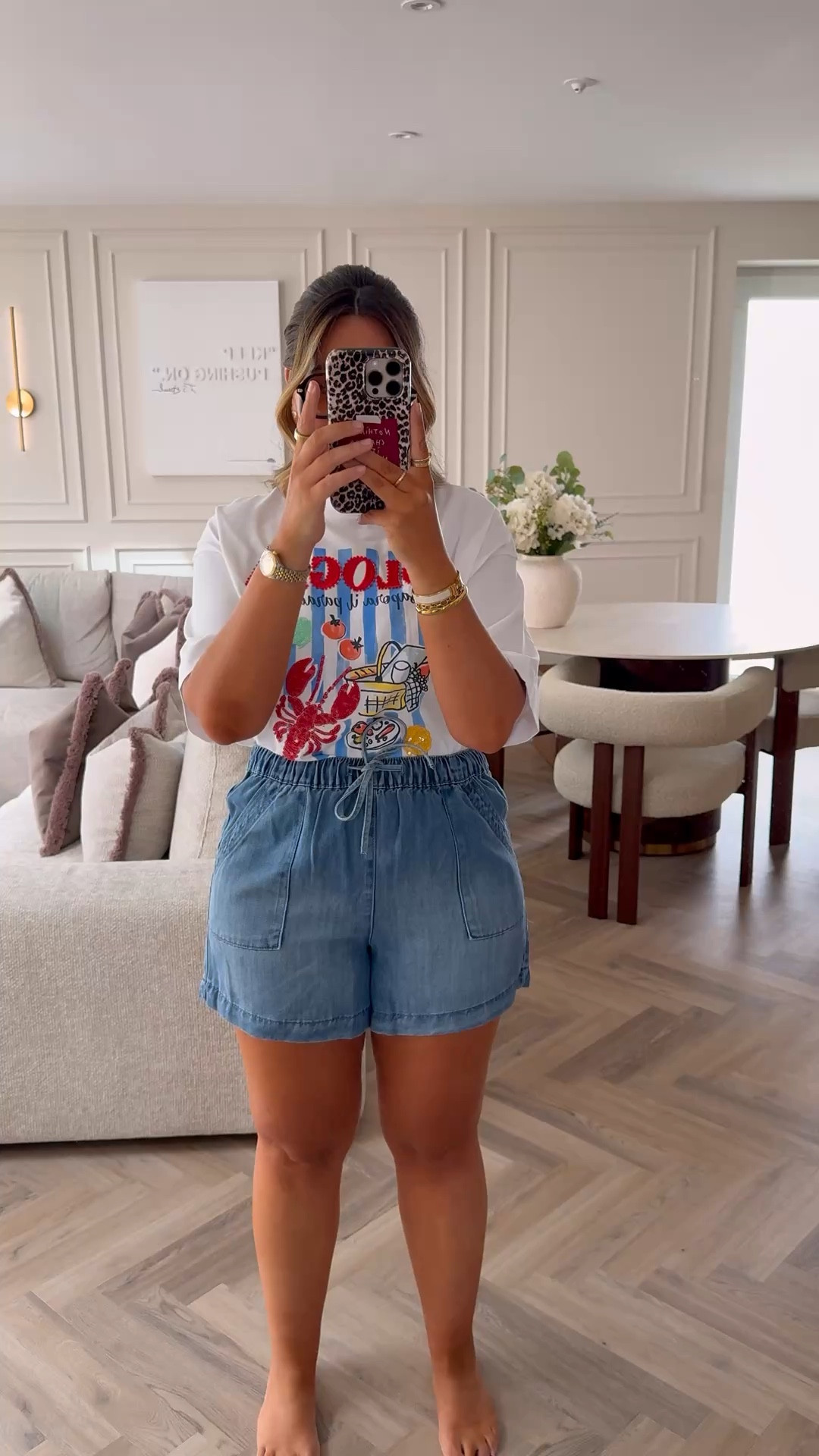 Shorts true to size! Wearing size 12 and they fit so well! Tie waist so perfect for us small waist & bigger thigh gals. Also soft denim material, they’re so comfy! 

Can’t beat a graphic tee, perfect for summer & will also be nice over a bikini top tied up at the front! It’s giving, city break outfit! 