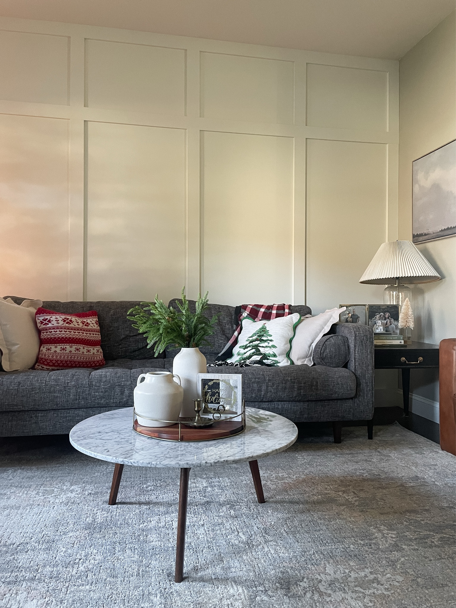 I love the simplicity of our living room decor for Christmas.  

Mid century modern gray sofa.  Marble coffee table.  Holiday pillows.  Stems.  Vase.  

#LTKHoliday #LTKHome #LTKSeasonal