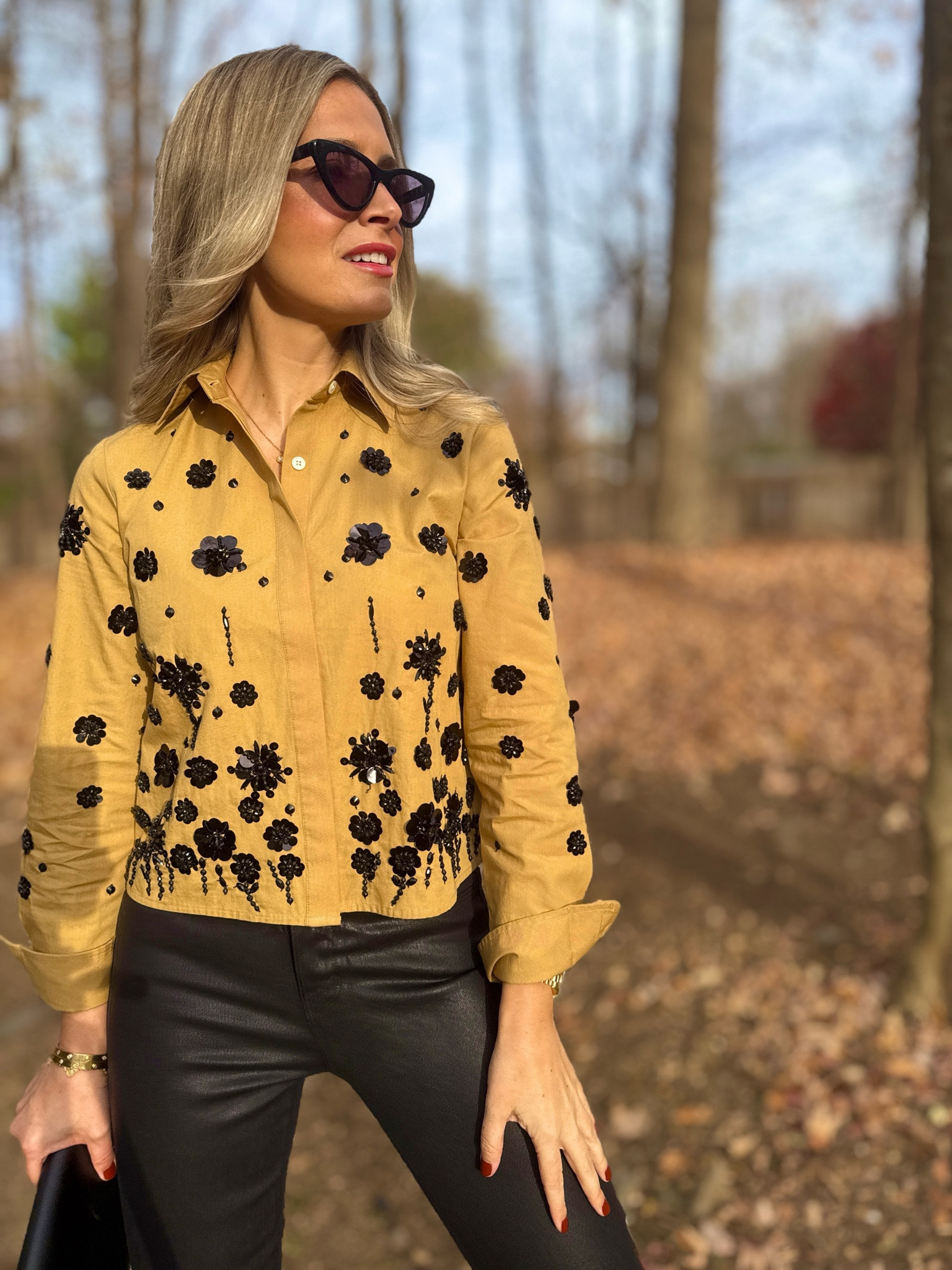 🍂🤎✨ Serving up Thanksgiving style that’s both chic and cozy. This embellished mustard colored blouse paired with sleek black faux leather pants makes the perfect dressy yet subtle fall look. I paired it with faux crocodile boots for some extra glam. ✨🪩

What’s your go-to Thanksgiving outfit: dressy or laid-back? 🍁🤎 
Shop the full look via LTK or link to blog in my profile. 

#LTKOver40 #LTKSeasonal #LTKHoliday