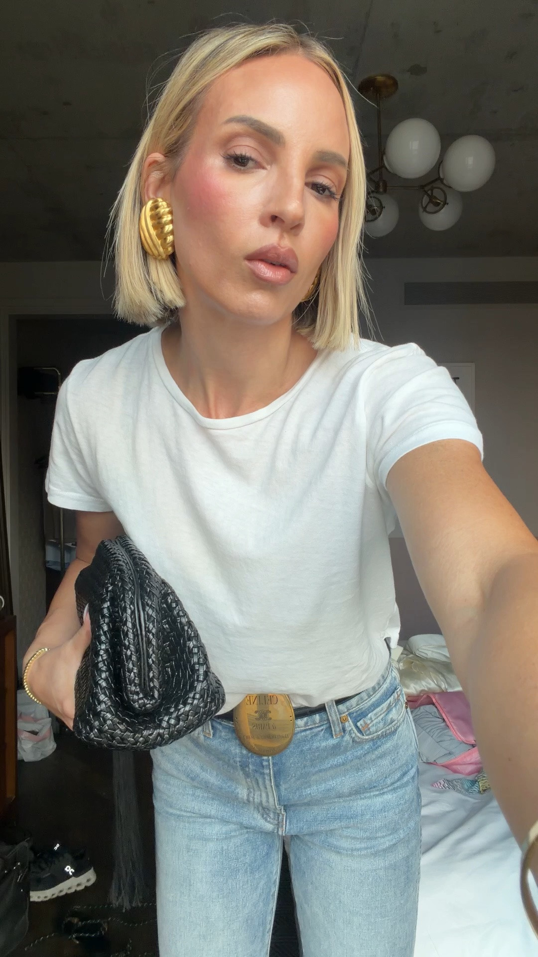 I was so stressed out in this video. The shirt I was going to wear lost button and I panicked and didn’t know what to wear and we were running late for our dinner reservations. Thank God a classic T-shirt, straight leg jeans, some heels, some great earrings and a fun belt and clutch will always work. ￼jeans run tts, wearing a small in the tee￼

#LTKootd #LTKOver40 #LTKTall
