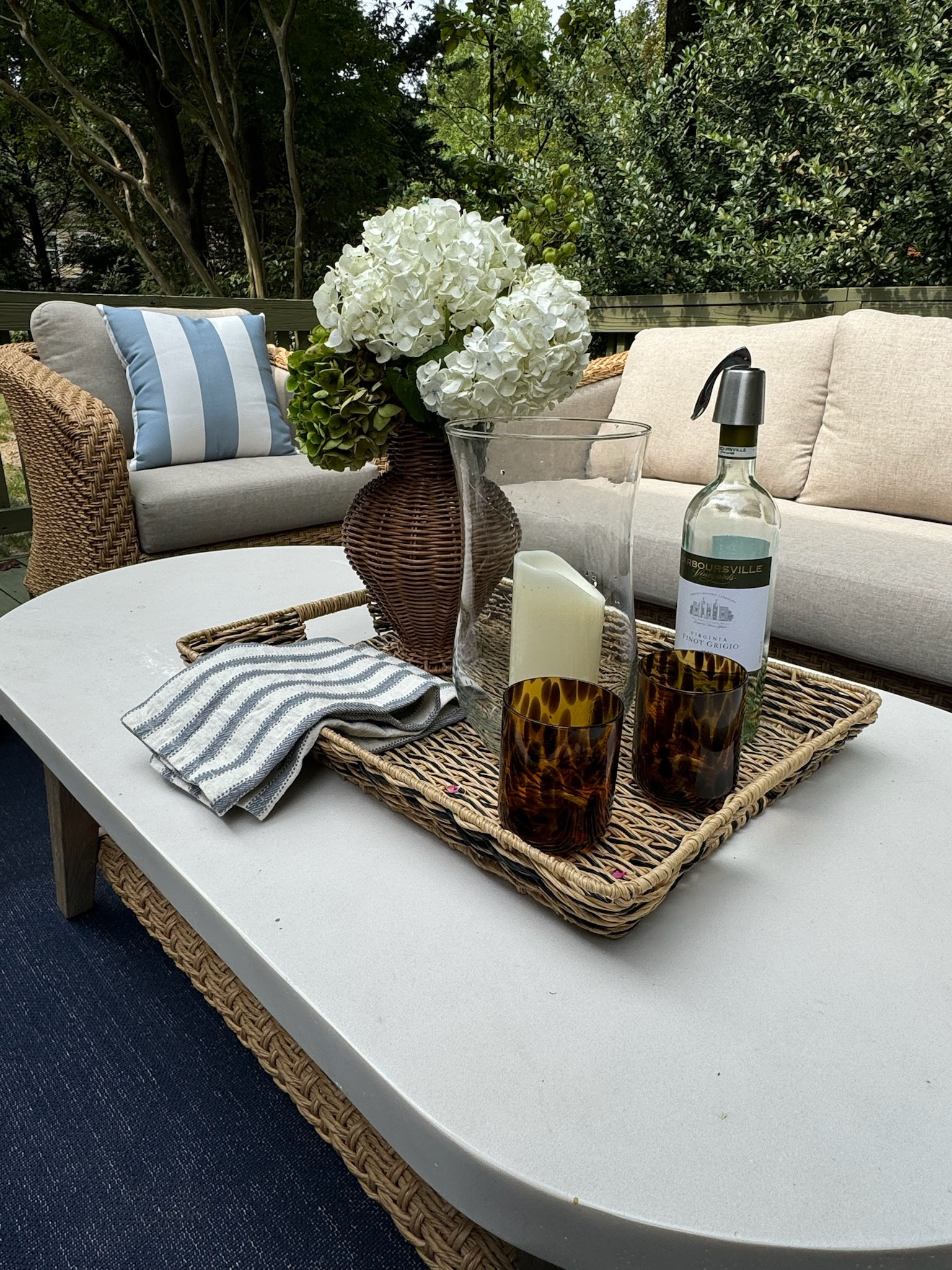 Using classic pieces to decorate our back patio. Outdoor dining, spring decor, Grandmillennial table, hurricane glasses, tablescape, outdoor coffee table

#LTKHome