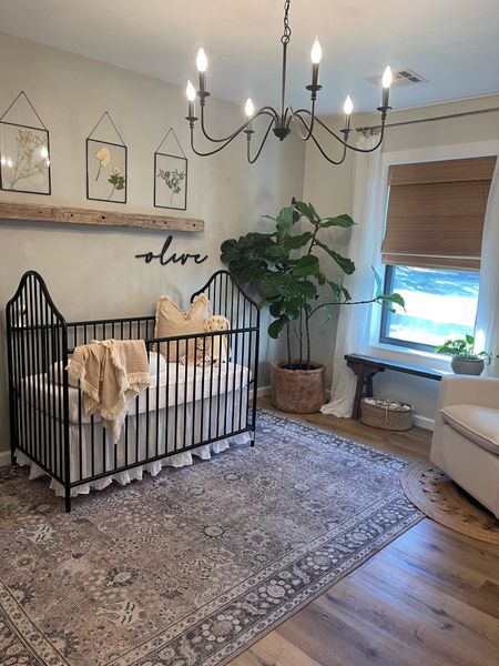 Neutral nursery. Baby girl. Washable rug. Metal crib. Amazon chandelier light fixture. Roman shades. Nursery glider  

#LTKbaby #LTKhome