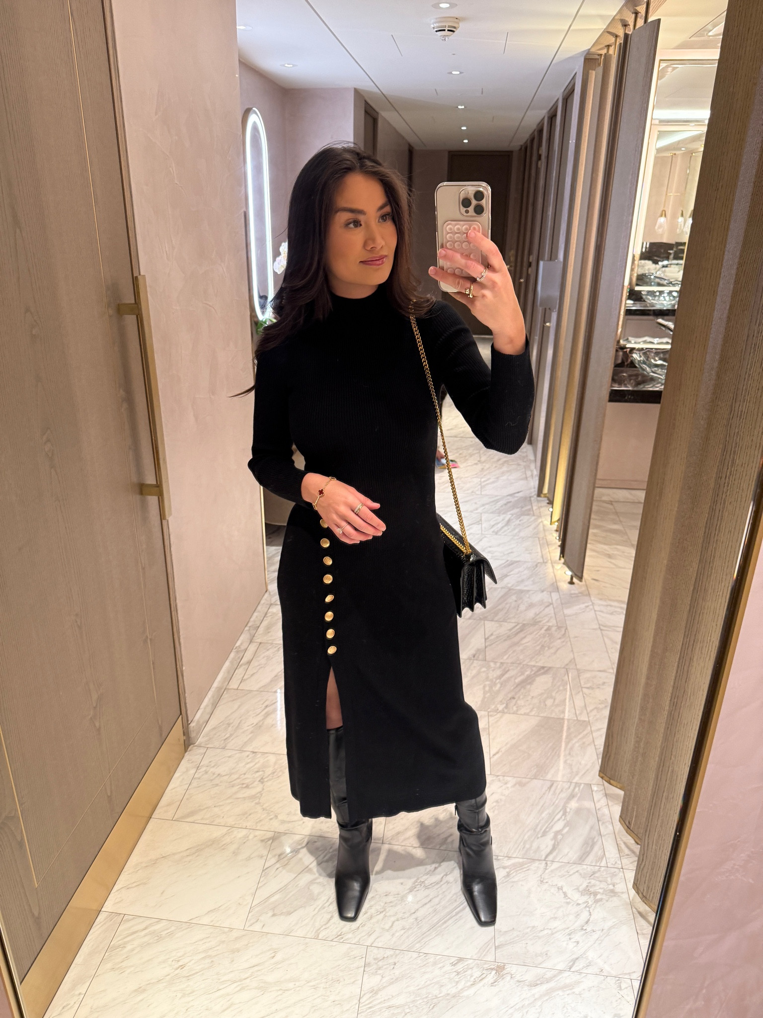 My Sezane black knit dress with gold buttons with high black boots in London ♥️✨

#LTKTravel #LTKHoliday #LTKSeasonal