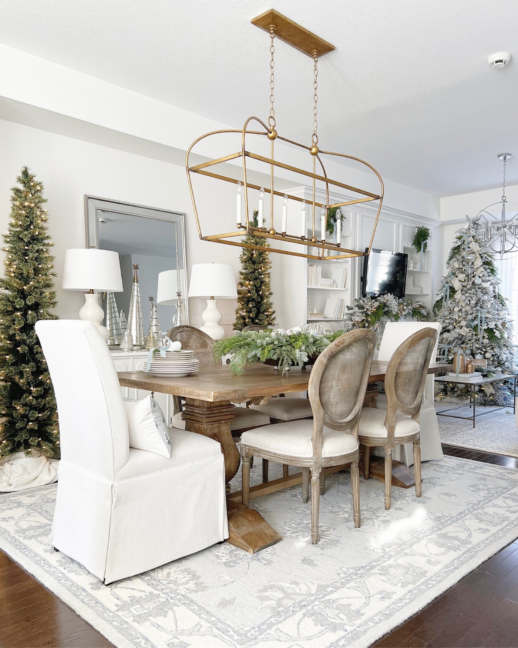 Holiday dining room decor. Christmas decor. Dining table. Safavieh rug. Brass chandelier  

#LTKhome #LTKHoliday #LTKsalealert