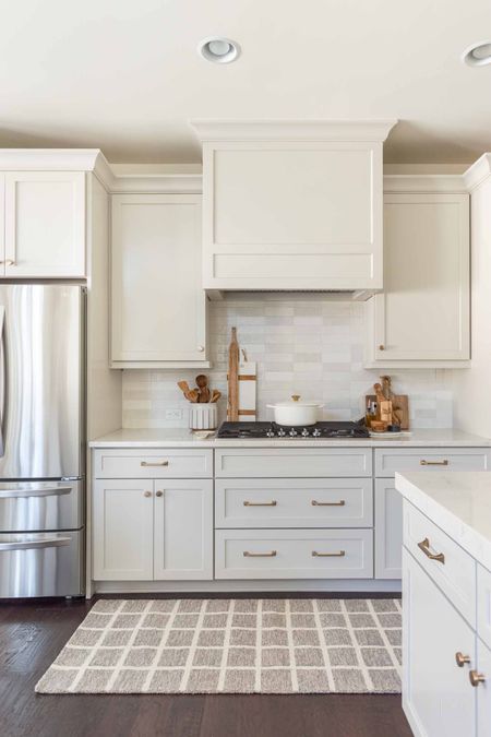 One of my favorite makeovers in the last year was my kitchen redo, where I repainted the walls, added white tiled backsplash and switched out the cabinet doors, hardware and color to Agreeable Gray. home decor kitchen decor neutral kitchen runner kitchen art champagne bronze cabinet pulls

#LTKfindsunder50 #LTKstyletip #LTKhome