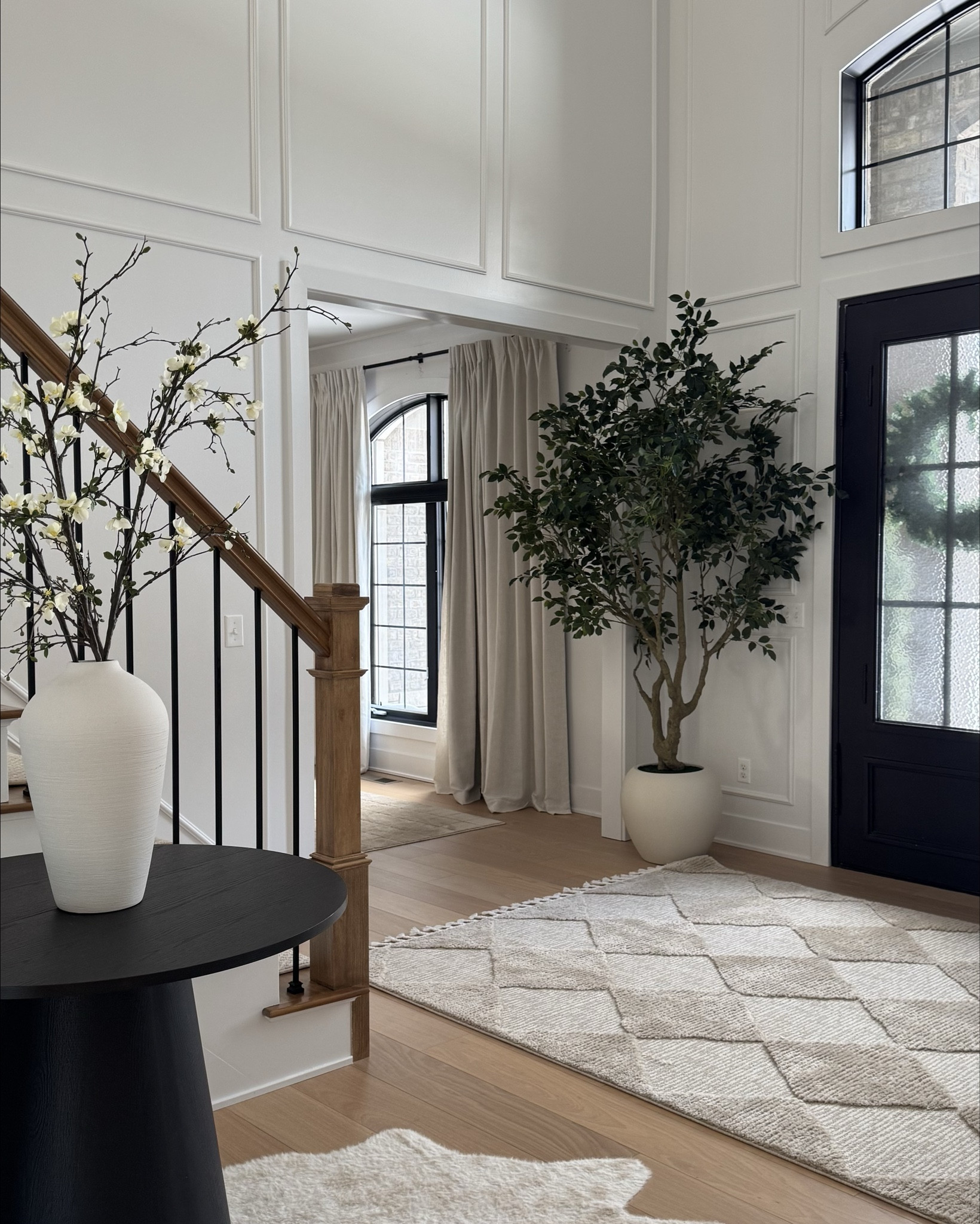 Neutral entryway with large tree 

#LTKSaleAlert #LTKHome
