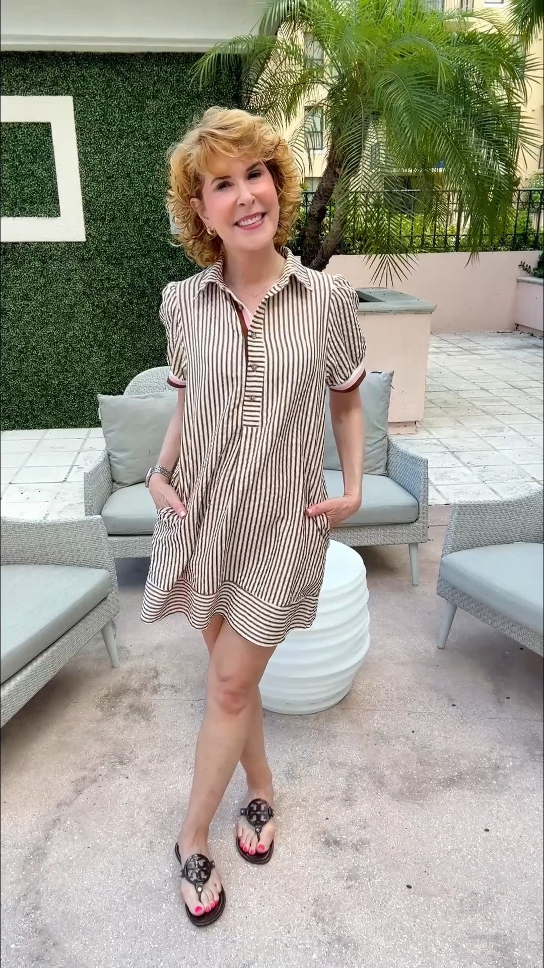 This striped mini shirtdress is lightweight, breathable, and made for warm days! The loose fit, polished half-button collar, and pockets keep it comfortable and cute—the pleat down the front is what makes the fit so flattering! Click through, because it comes in lots of color options—several of them would work for game day! I paired it with chocolate brown patent sandals - a perfect transition-to-fall shoe if you live in a hot climate!

#LTKootd #LTKTravel #LTKOver40
