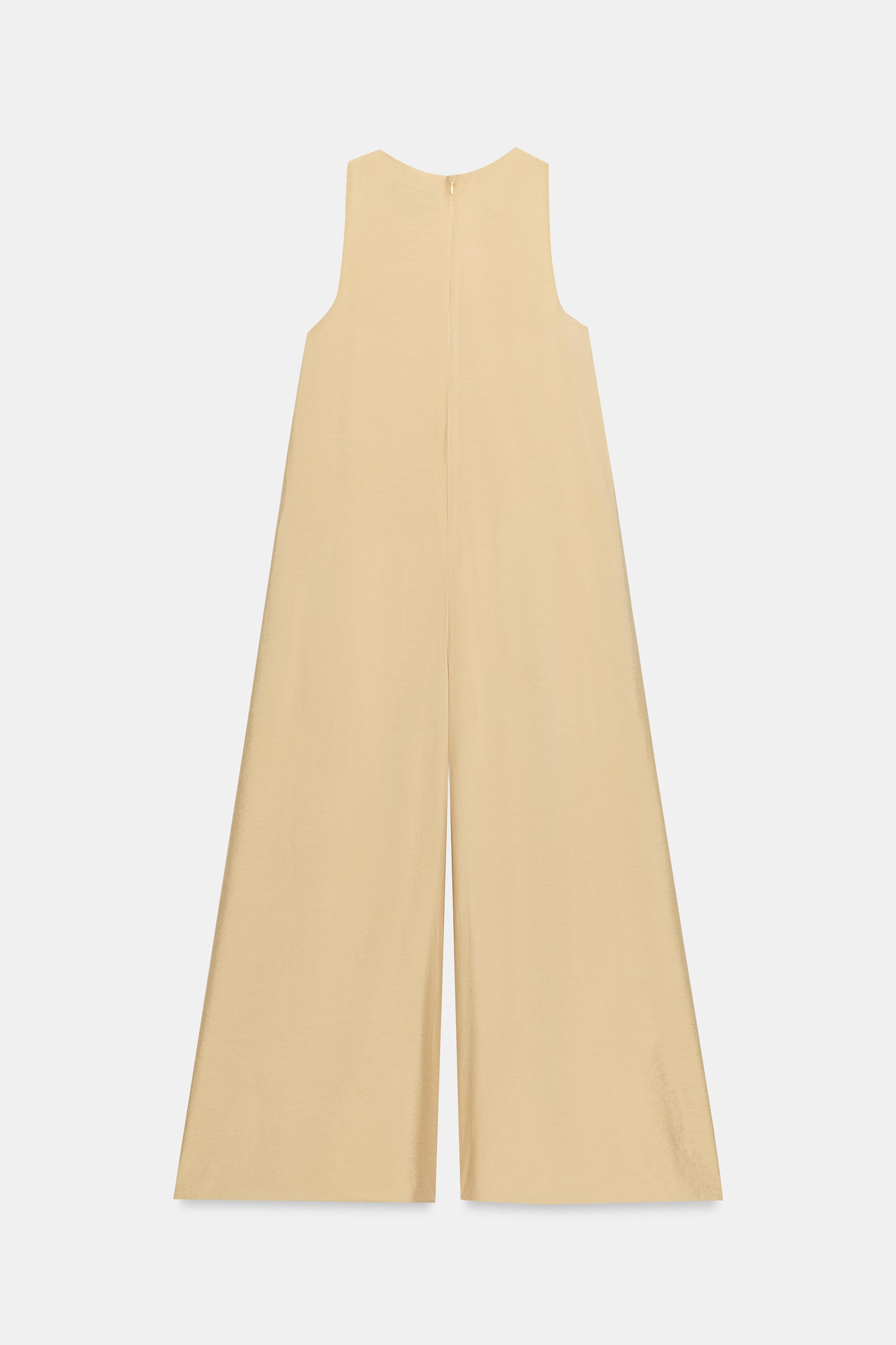 Round neck jumpsuit with sleeveless design. Featuring a very wide-leg cut, matching inner lining ... | Zara UK