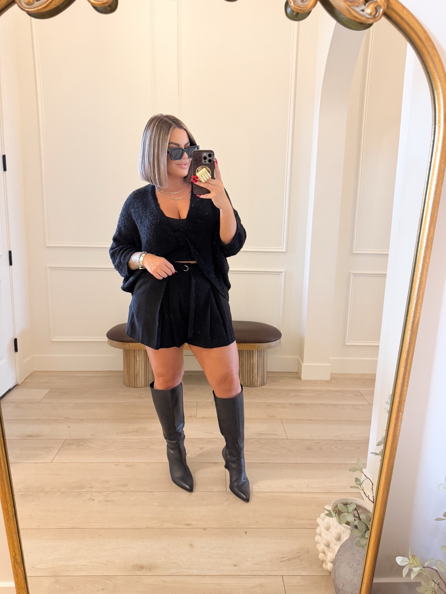 Sweater size M just wearing a black sports bra under you can do any tank or cropped tank or even just wear a bra and show more skin. 
( sells out every year really fast snag it now ) 

Shorts size 12 waist runs a little snug if between sizes size up. 

Boots linked exact and the amazon look 4 less.