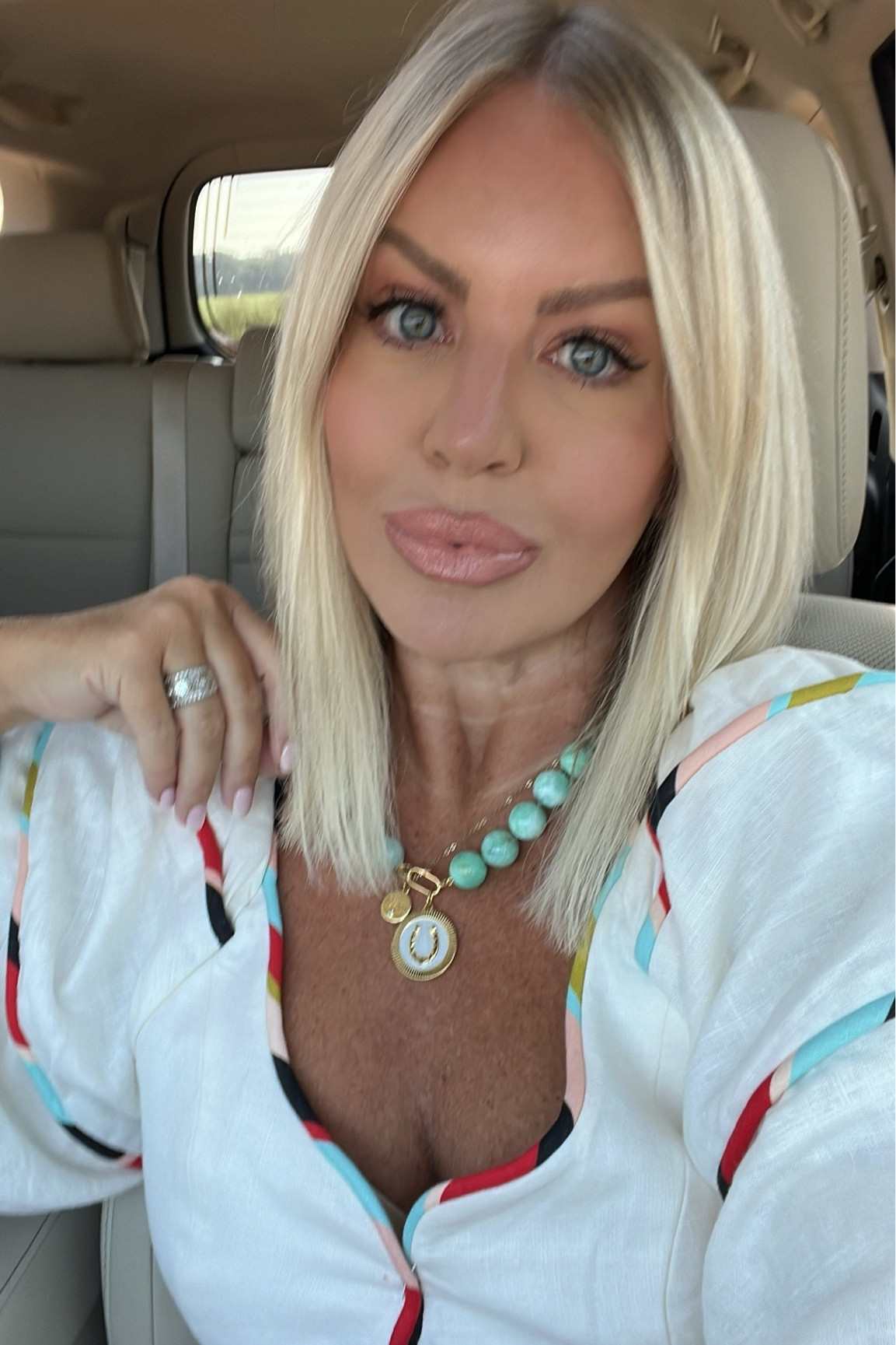 The most beautiful Chrysoprase gemstone necklace in stunning turquoise with a horseshoe poker chip necklace + charm clip included by HART. 

Tiny gold necklace by HART. 
Small Mama Charm with gemstone.

Western style. Western wear. Gold jewelry. Gold necklace. Gifts for her. Gifts for mom. HART. Nashville style. Charleston style  
Dress by Farm Rio  

#LTKover40 #LTKstyletip #LTKSeasonal