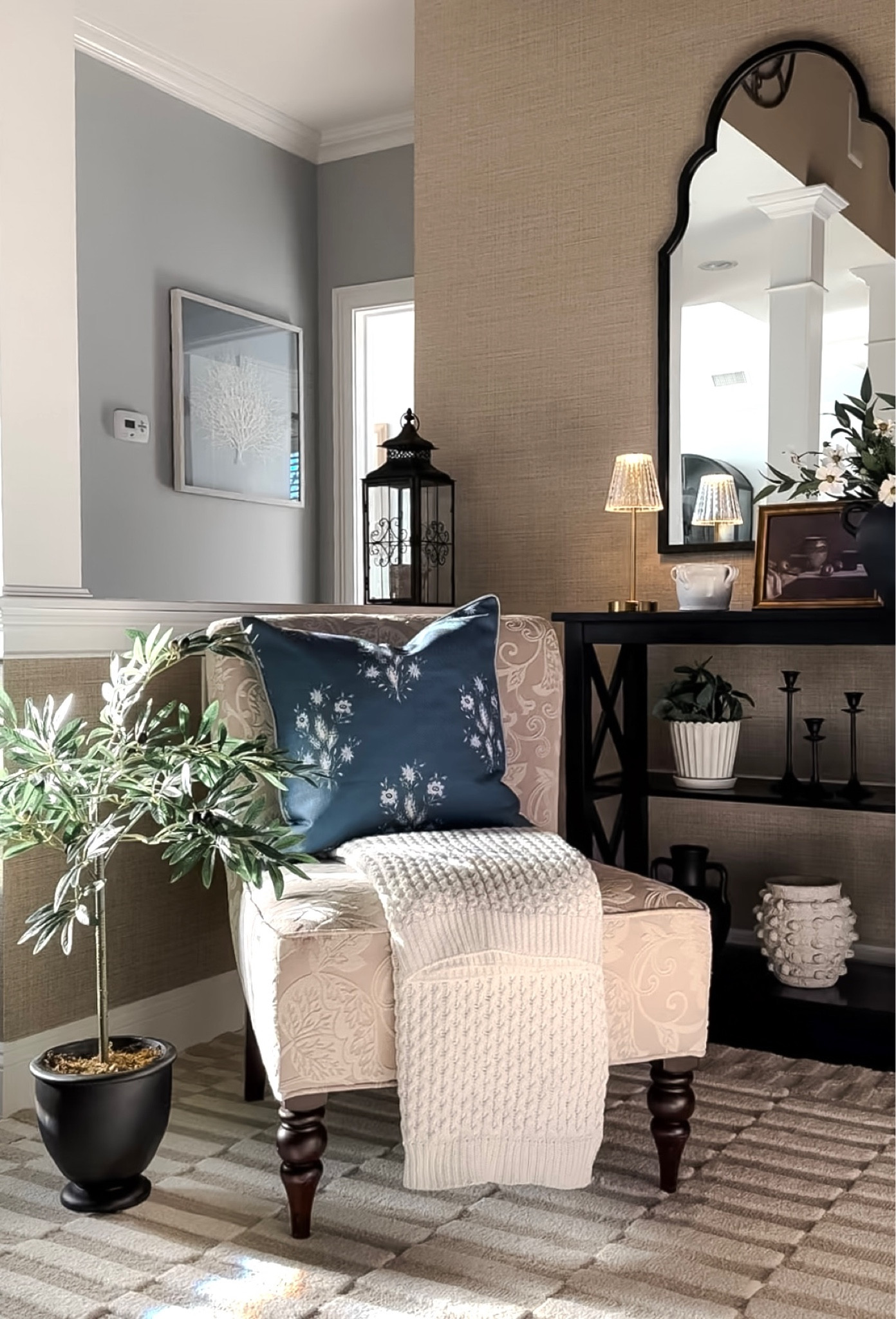 Favorite new finds from my entryway! New neutral rug, potted olive tree, favorite blue throw pillow, neutral throw blanket, mirror on sale, touch light, scallop planter, faux plant, Emery candle, side chair, console table. Target, Amazon home, Kirkland’s, Pottery Barn. Free shipping, sales. 

#LTKfindsunder50 #LTKsalealert #LTKhome