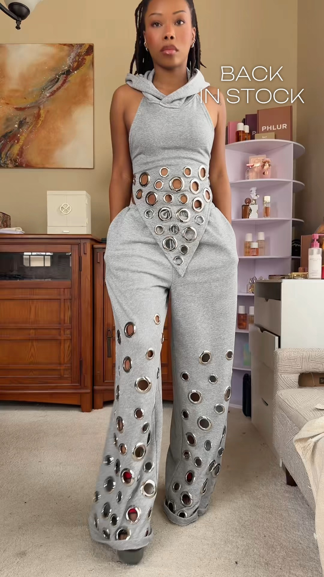 Okayyy, the matching set is SETTING. 😮‍💨🖤 The AKIRA Check It Out Grommet Top + Grommet Jogger Pants are giving edgy, effortless, and seriously cool.

The grommet detailing + relaxed jogger silhouette bring the perfect streetwear vibe while keeping the outfit easy to style. Wear them together for the full coordinated look or mix each piece with your existing wardrobe.

📏 Top: Size 1X
📏 Jogger Pants: Size 2X

Perfect for casual days, concerts, travel, errands, streetwear looks, and laid-back weekend outfits.

🛍️ Shop both pieces on my LTK!

#LTKfashion #LTKfinds #LTKstyle #AKIRA #AKIRAFashion #GrommetTop #GrommetPants #JoggerPants #MatchingSet #TwoPieceSet #StreetwearStyle #EdgyStyle #CasualOutfit #WomensFashion #FashionFinds