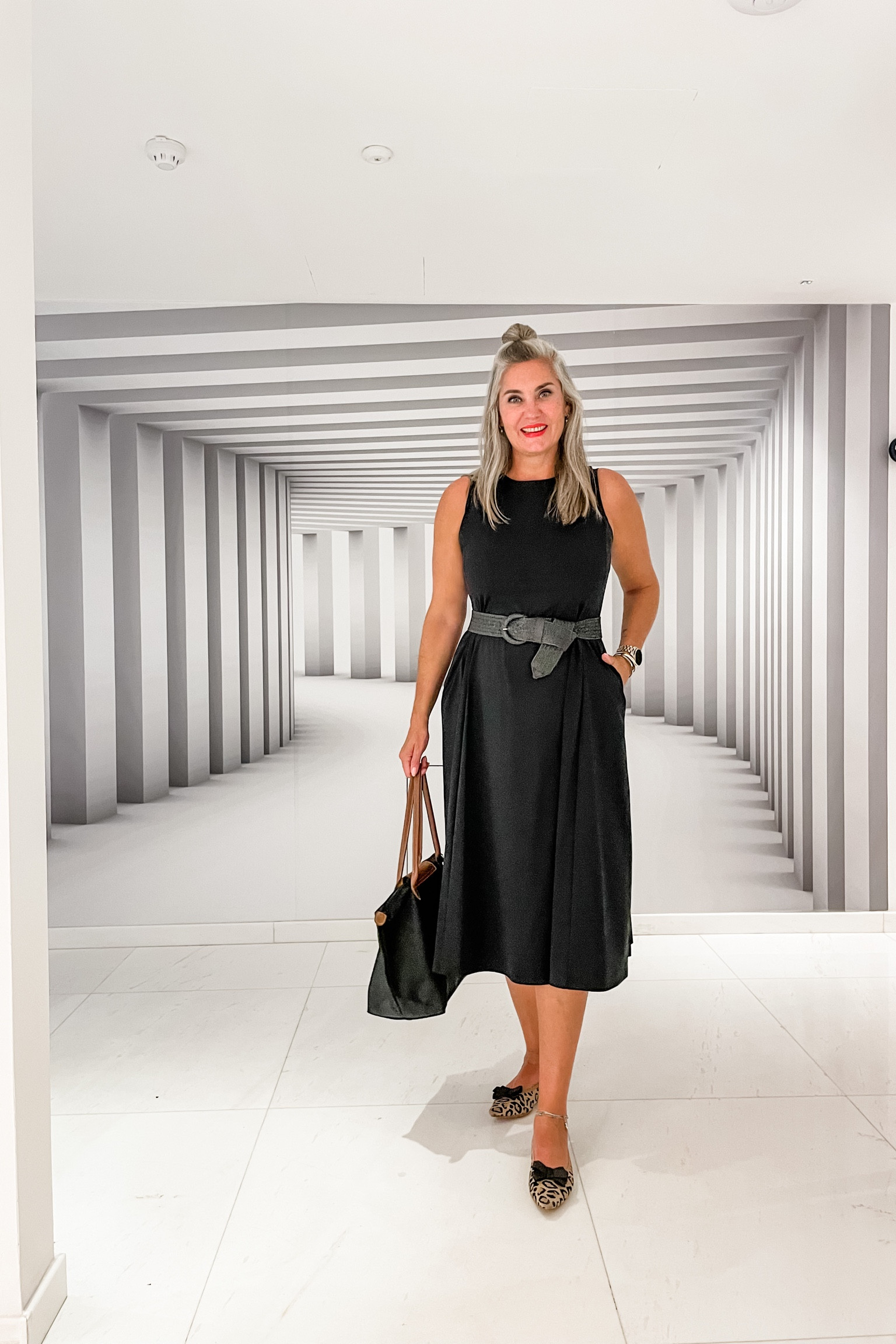 Outfits of the week. Ready for dinner in this black Uniqlo midi dress. It has pockets and the material is perfect for traveling. It keeps you cool and doesn’t crease. Paired with comfortable Vivaia leopard pointy toe flats with a little black bow (removable). A black woven belt and black Longchamp bag. 



#LTKover40 #LTKeurope #LTKtravel