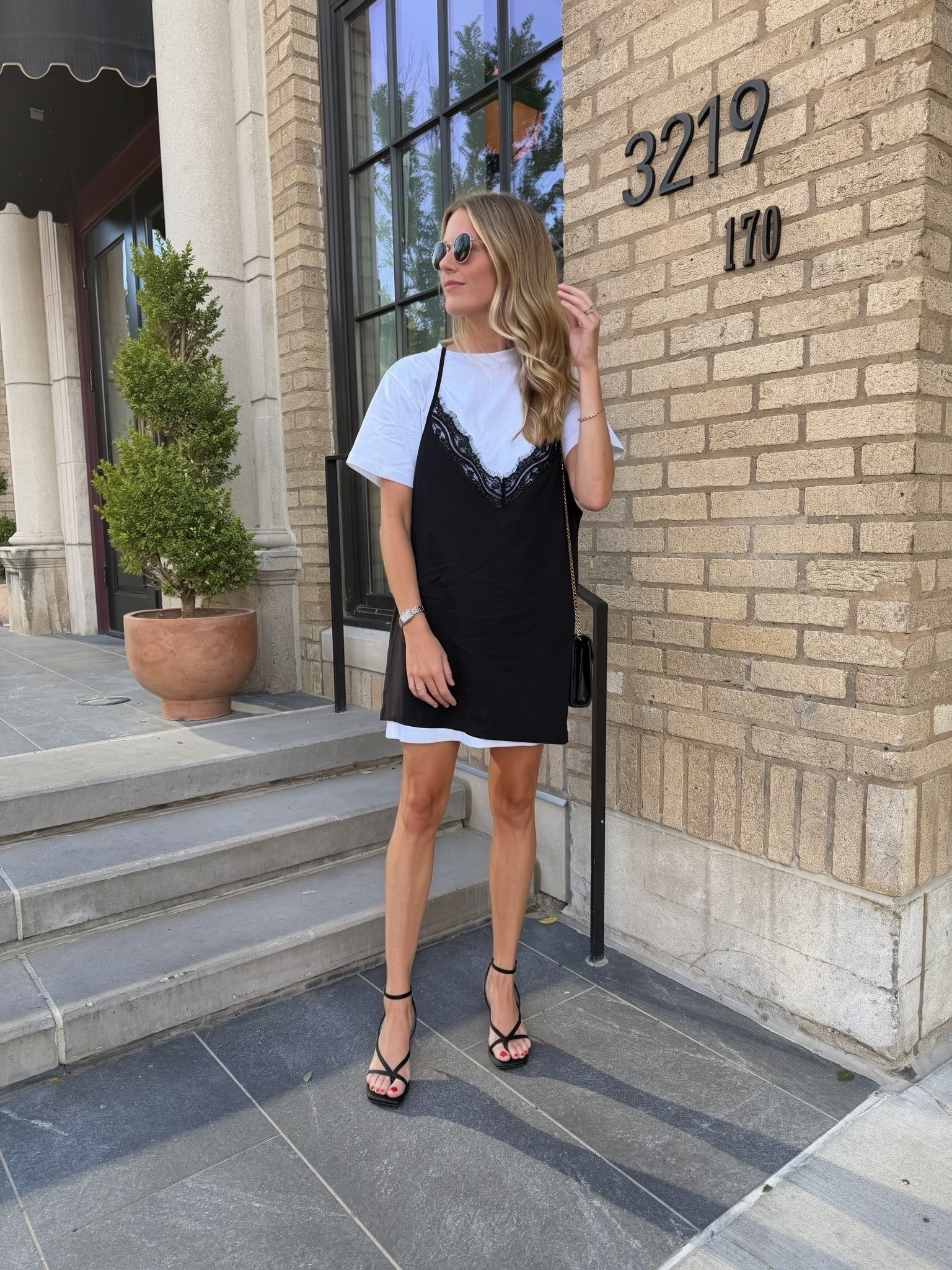Layered black lace camo mini dress and strappy black heels