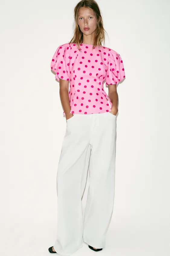 Round neck top with short puff sleeves and pleats. V-neck at the back. Polka dot print and hem wi... | Zara UK