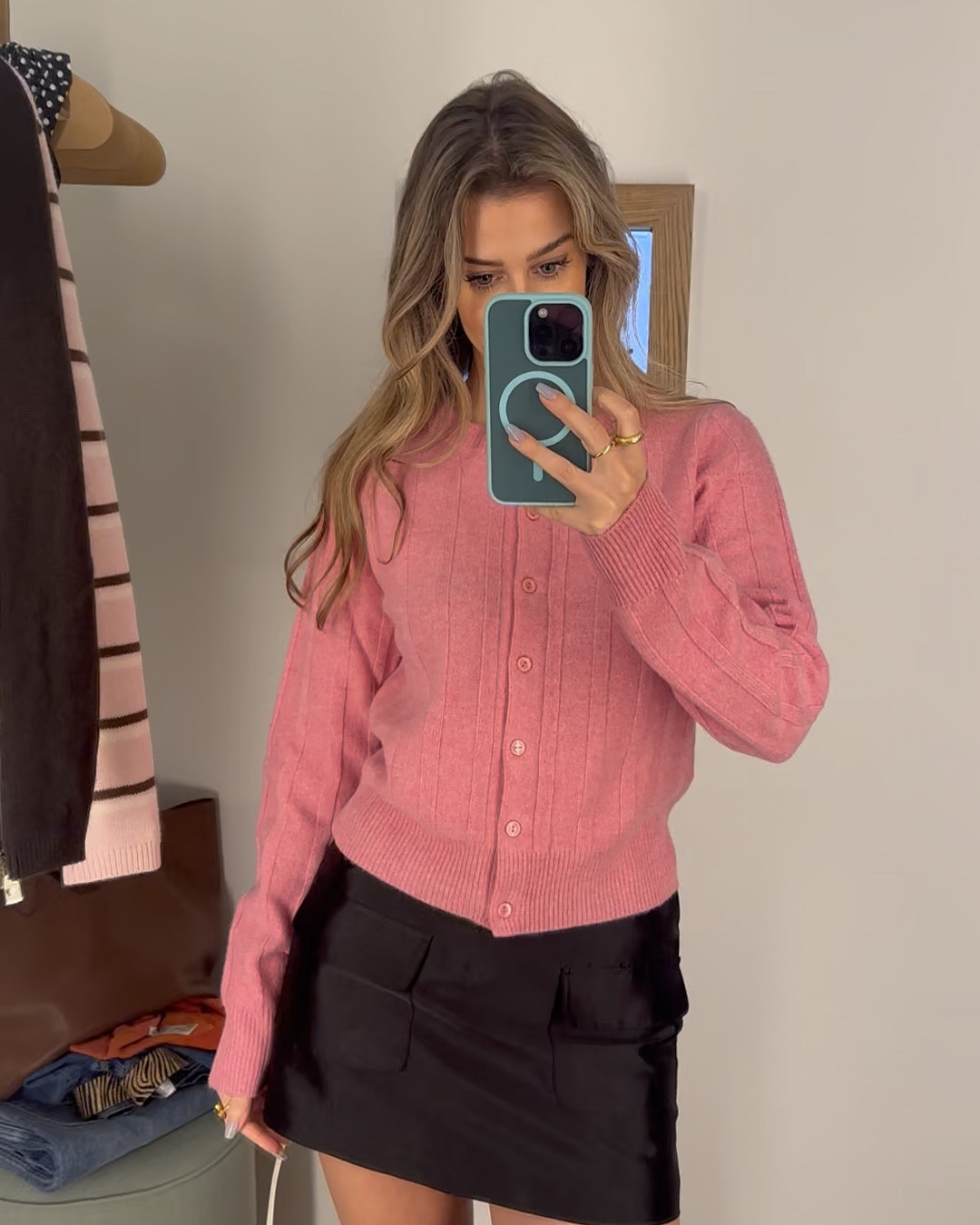 Had to get this so soft cardigan/sweater in color “peony”. I tried it on with a silk low rise black mini SKORT, that’s right, there are hidden shorts under the skirt. In the first video I’m wearing the 4 and in the second video I’m wearing the 2. Both fit, just a preference of if you want more or less room/coverage! 
#Reformation#FallSweater#Cardigan#MiniSkirt#Skort

#LTKSeasonal #LTKWorkwear #LTKStyleTip