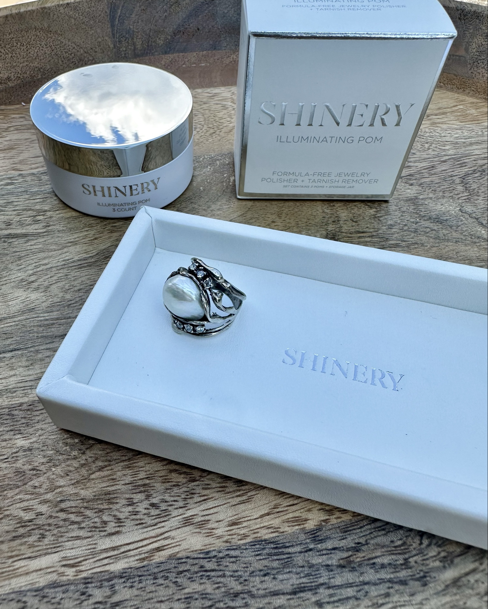 The Illuminating Pom Tarnish Eraser + The Daily Tray from Shinery is a game-changer for tarnished or dull jewelry, particularly for sterling silver and gold. I used the Tarnish Eraser on this tarnished sterling silver ring and it looks new again! 

You can see the buildup on the Illuminating Pom. I love that it’s formula-free and scent-free, and the sponge-like material removes tarnish without any polishing agents. 

You can also use it as a buffer to keep your jewelry and gemstones clean. Simply rub on your jewelry to buff and polish. It can be re-used for multiple cleanings. It’s perfect for travel and at home because you don’t need water to clean. Make sure both the Illuminating Pom and your of jewelry are dry.

You will love this!!!! @Shinery #jewelrywash #ShineryJewelryWash #ad

#LTKHome #LTKFamily #LTKTravel