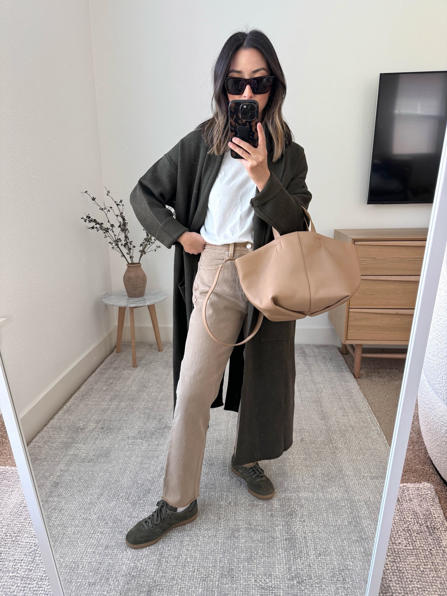 Mango olive coatigan. On sale! Love this color! The darker color looks less overwhelming than my nude one. Wearing the xs. Oversized fit. Thanksgiving outfit

Mango coatigan xs
Everlane tee medium
Gap jeans 26 short 
Adidas samba 4 men’s. 
Mansur Gavriel tulipino full size. Linked the mini. 
Celine sunglasses  

Fall outfits, fall style, fall fashion, fall shoes, thanksgiving outfits 

#LTKsalealert #LTKCyberWeek #LTKHoliday