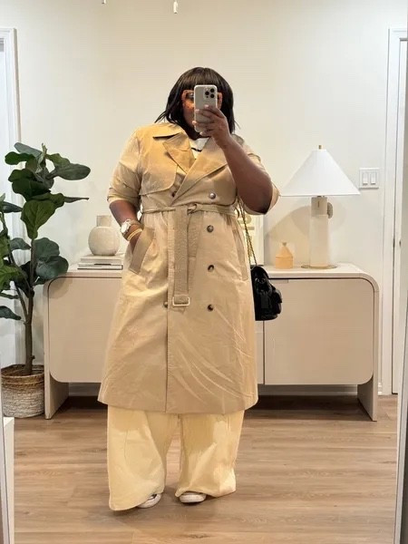 Wide-leg pants and sneakers are proof that comfort can still look chic. Layering a structured trench coat over the outfit adds polish without sacrificing that relaxed feel. It's a practical formula for travel days, shopping trips, and casual weekends. beige trench coat outfit, women's fall fashion, wide-leg pants outfit, cream trousers outfit, neutral fall outfits, classic trench coat, how to style a trench coat, casual chic outfit, fall capsule wardrobe, affordable trench coat alternatives. @amazonfindsandfashion @boohoo @ASOS