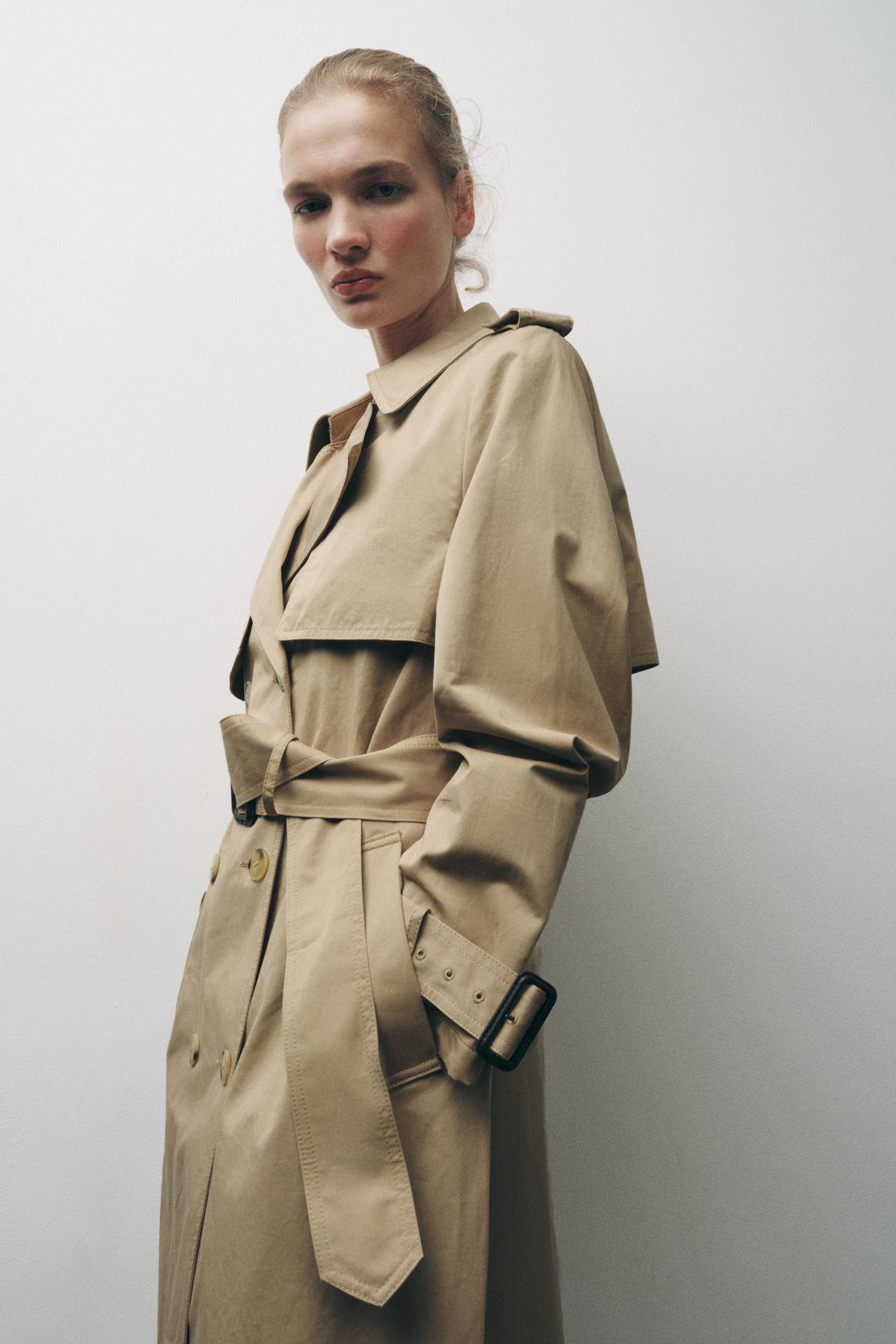 ZARA WOMAN COLLECTIONTrench made of 100% cotton. Notched lapel collar and long sleeves with butto... | Zara US