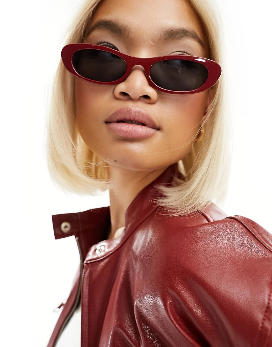ASOS DESIGN small slim oval sunglasses in red | ASOS (Global)