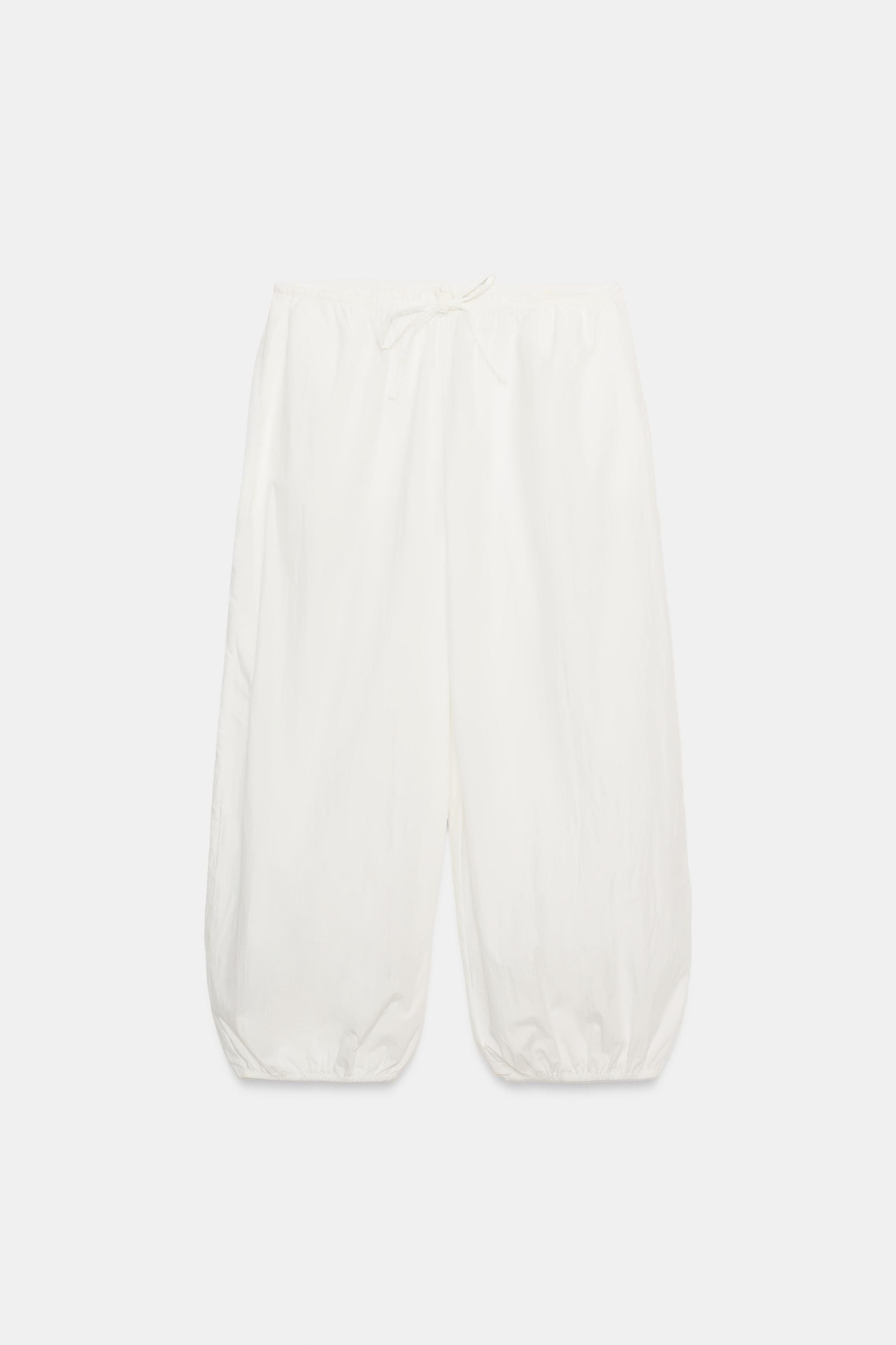 Trousers crafted from a cotton and polyamide blend. Mid-rise with an elasticized waistband. Featu... | Zara US