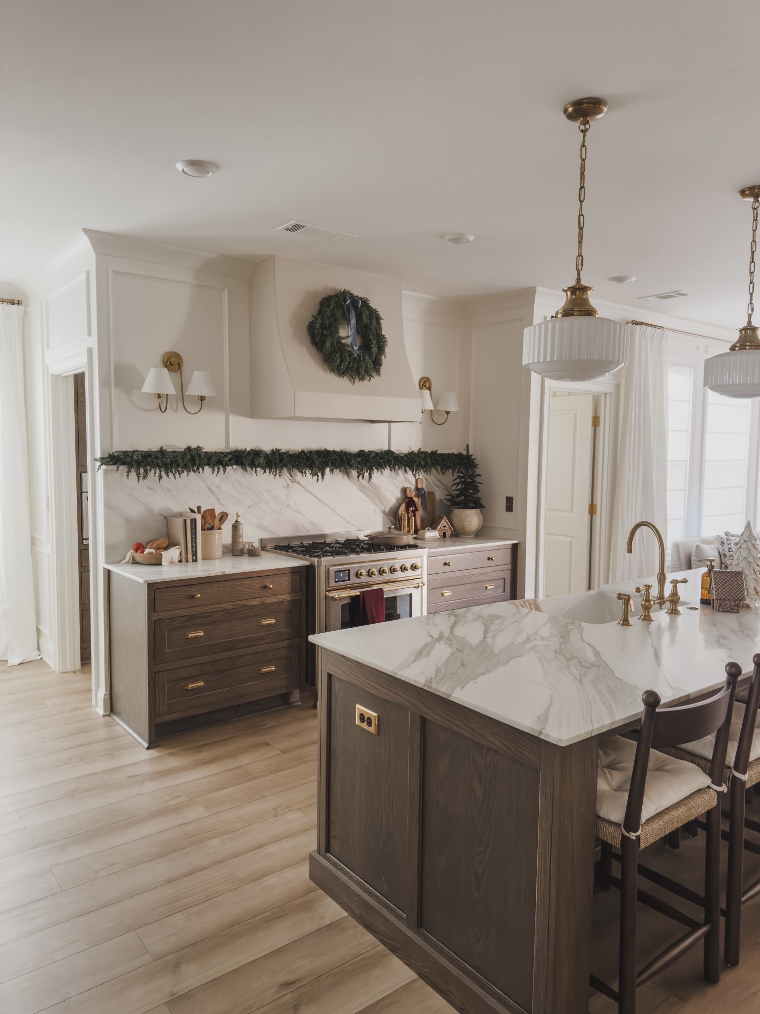 Holiday kitchen views showcasing draping green garland and wreath, simple ribbon touches and a pop of seasonal color.

Home finds, neutral home inspo, holiday home views, open concept kitchen, rich wood tones, unlacquered brass, counter stool, brass faucet, wall sconce, collected style, linen curtain, brass hardware, Walmart, Visual Comfort, Rejuvenation, McGee and Co, Home and Kids Co, Pottery Barn style, shop the look!

#LTKSeasonal #LTKHome #LTKHoliday