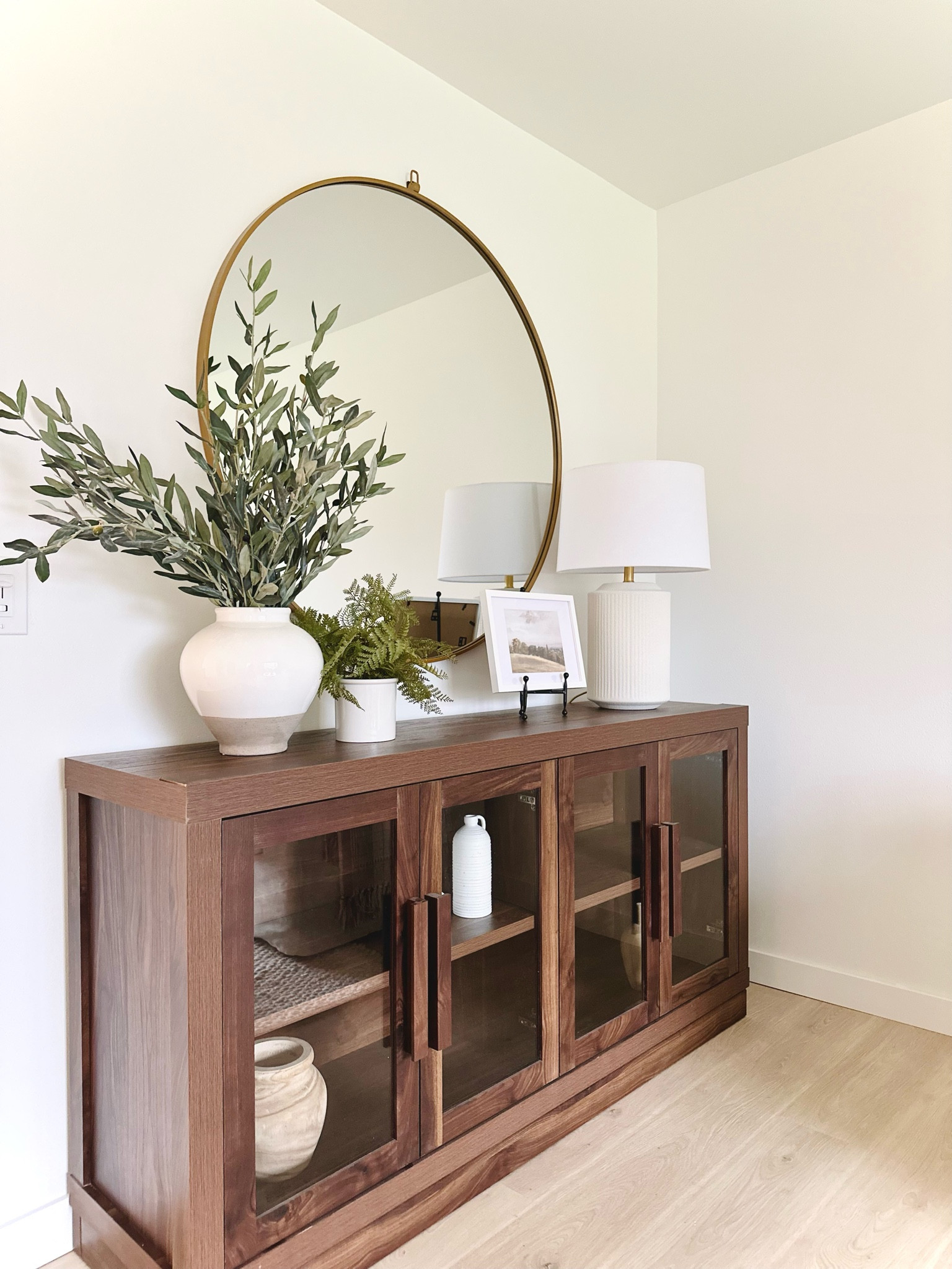 Glass cabinet, round mirror, tv cabinet, storage cabinet, console table, wood cabinet, home decor, home design, lamps, living room furniture, living room ideas 

#LTKHome #LTKStyleTip