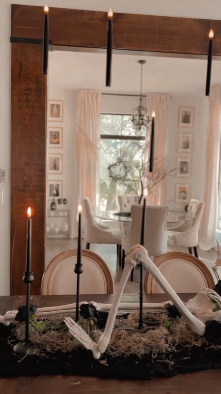 Spooky Halloween dining table Skeleton centerpiece and hanging candles 

#LTKHalloween #LTKhome #LTKparties