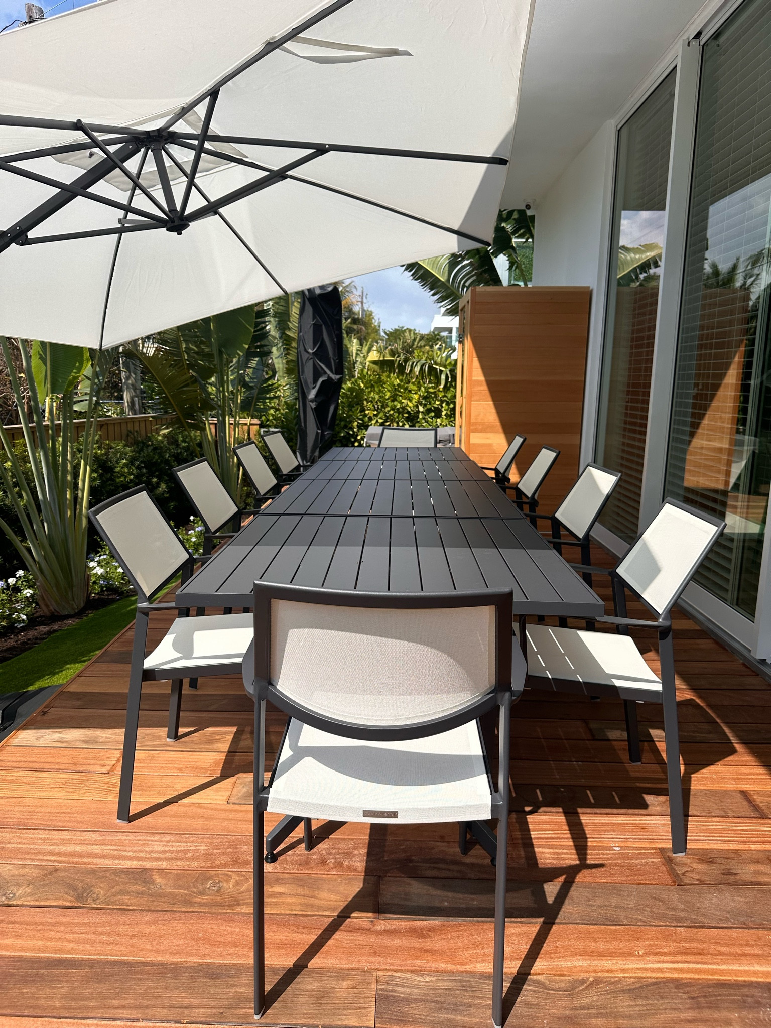 My fav place to sit :) we have 4 of the crate and barrel outdoor tables all together + their stackable chairs. Easy to move and put away because the tables turn and are easy to store!! 

#LTKfamily #LTKhome