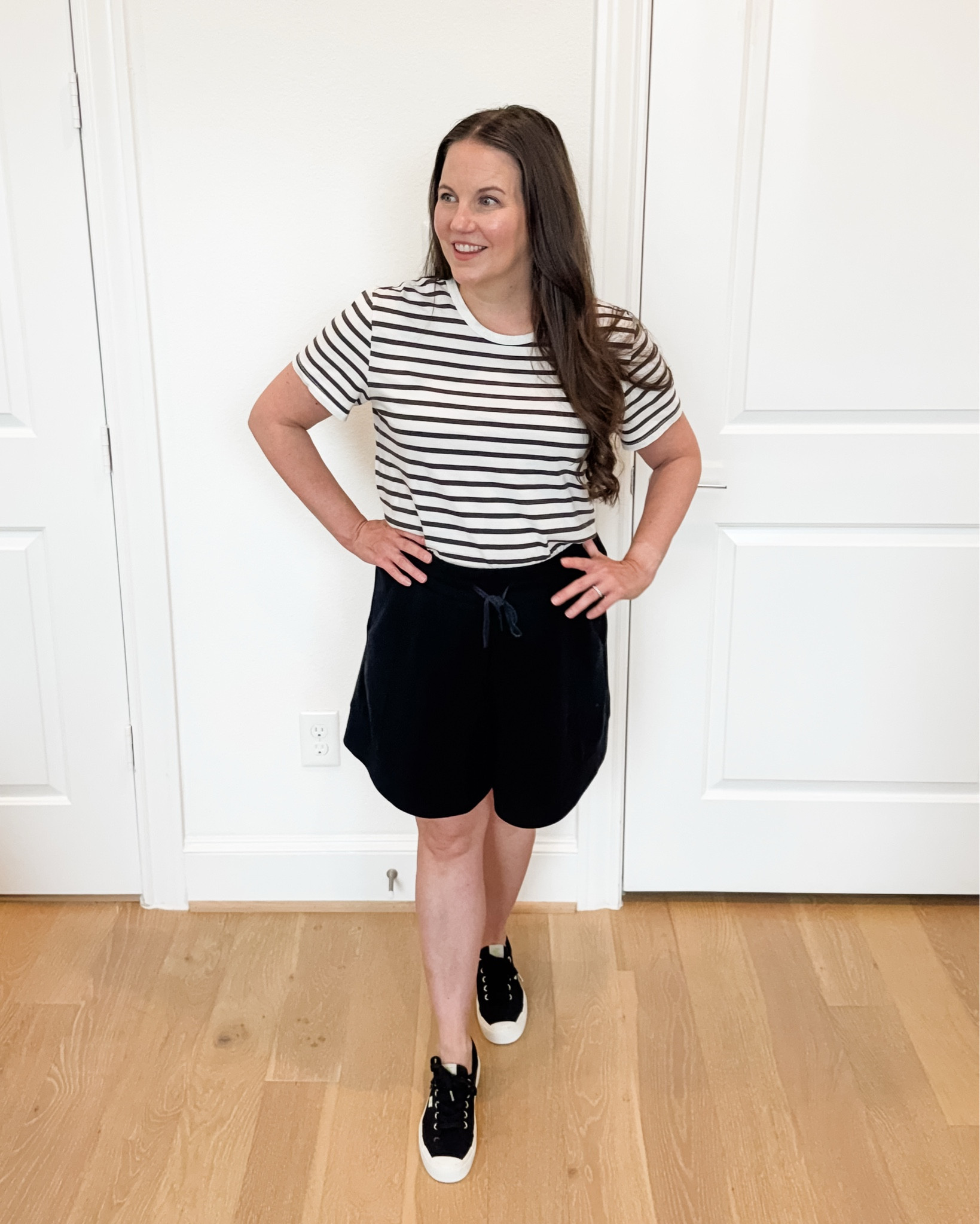 Easy summer outfits are my go-to this time of year. This casual mom outfit combines a classic striped top with comfy drawstring waist black lounge shorts and black sneakers for a look that’s comfortable, practical, and still put together. Whether you’re running errands, chasing little ones, heading to the airport, or sightseeing on vacation, this is the perfect vacation outfit you’ll reach for again and again. These black lounge shorts are lightweight, versatile, and an everyday summer staple that pairs with everything in your closet.

#LTKSeasonal #LTKOver40 #LTKmomlife
