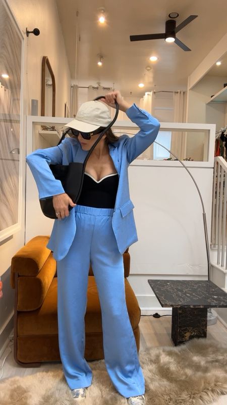 The new suit trend but casual is too good. This blue is also the color of spring/summer 24. A blazer and trouser paired with a cap and sneakers! Its a must

Ss24, spring 2024 trends, casual work wear, business casual, street wear 

#LTKstyletip #LTKover40 #LTKSeasonal