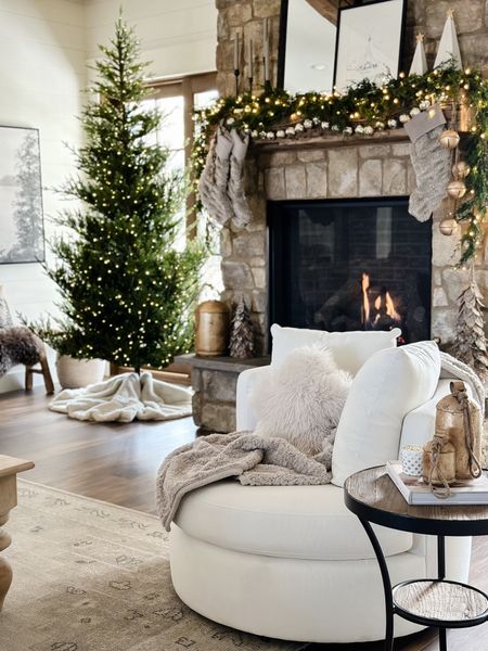 Holiday Living Room
Holiday mantle
Fireplace 
Swivel chair

#LTKhome #LTKHoliday #LTKstyletip