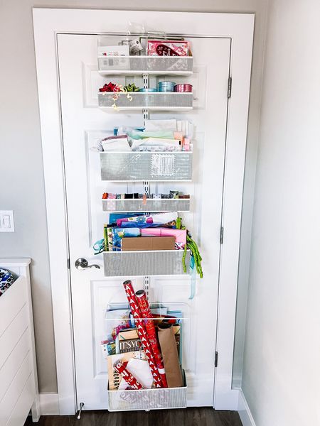 Elfa over-the-door wrapping station! Literally our favorite way to store wrapping paper, gift bags, tissue paper, ribbon and stationary! There are endless options with these over-the-door units. 

#LTKhome #LTKfamily
