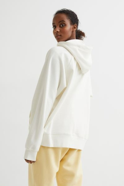 Soft, oversized sweatshirt jacket. Lined, drawstring hood, zipper at front, and kangaroo pockets.... | H&M (US + CA)