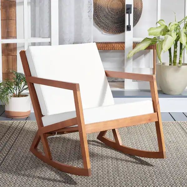 Enjoy the ultimate relaxation experience with the SAFAVIEH Outdoor Vernon Rocking Chair. This han... | Bed Bath & Beyond