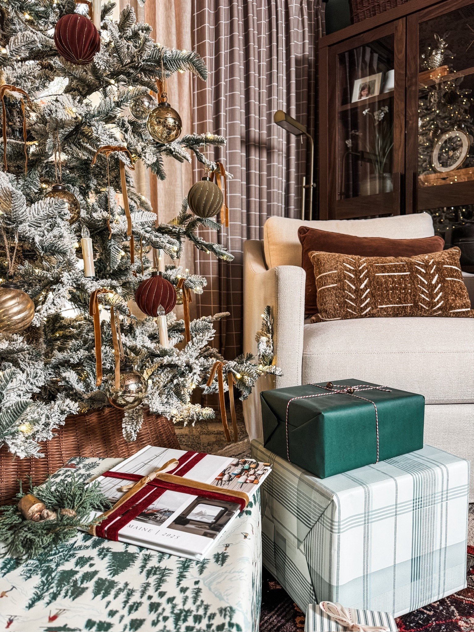 A flocked tree dressed in gold and burgundy ornaments, glowing candle lights, and earthy textiles make this the coziest Christmas corner. We layered plush pillows, neutral armchairs, a patterned rug, and beautifully wrapped gifts to create a look that feels timeless and inviting. 🎄

#holidaydecorideas #classicchristmas #cozyhomevibes #seasonaldecor #holidaydesign #eanesinteriors



#LTKHome #LTKSeasonal #LTKHoliday