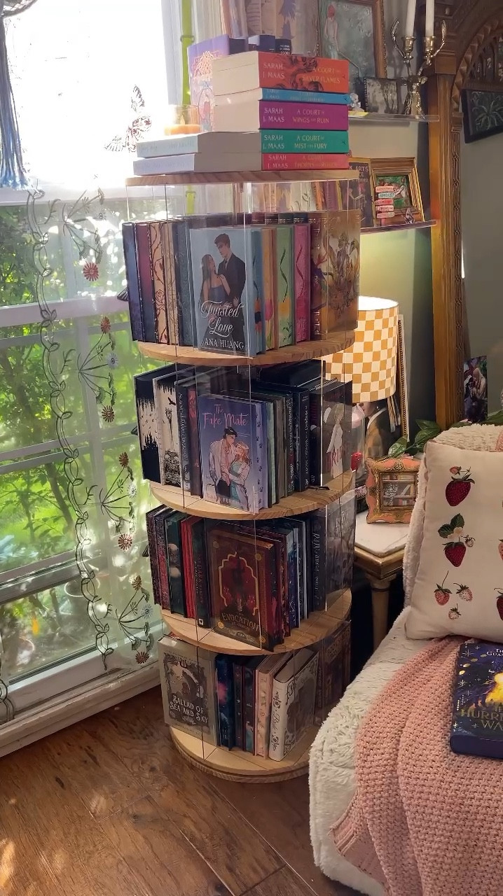 📖 I decided to shoot my shot with a company and ask them if they would exchange their rotating bookshelf for an honest review and they said yes! I’m a nano creator so I was overly excited about that haha. I’ve had this bookshelf in my Amazon cart for months. I love it because the clear inserts help display multiple angles of these pretty special edition books ❤️ my dream is to make my living room the coziest, whimsy, bookstore vibes space. 

It was very easy to set up. The only part that took long was removing the protective film from the clear inserts but I had my 10 year old son help me knock those out. 😂 and it is very sturdy. I ended up moving the shelf away from my window so my books wouldn’t get damaged in the sun. It was very easy to move and didn’t fall apart or anything. The quality and size were WAY better than I thought it would be. 
I think this is not only great for books but would be great for collectibles, purses, shoes, and children’s books and toys. 

I also linked some special edition books you can order or preorder on Amazon with stenciled, sprayed, and printed page edges. A lot of my books are from book subscriptions but now you can get a lot on Amazon too. If you preorder the books with Amazon, they do NOT charge you until the book ships. And they have a price guarantee so if there is ever a sale or the book price drops when you have the book preordered, that is the price you will be charged when the book ships. 

#booklover #bookshelf #bookshelforganization #bookshelfinspiration #amazonfinds #gifted #booksbrat #amazoninfluencer #ltkhome 

#LTKHome #LTKFamily #LTKVideo